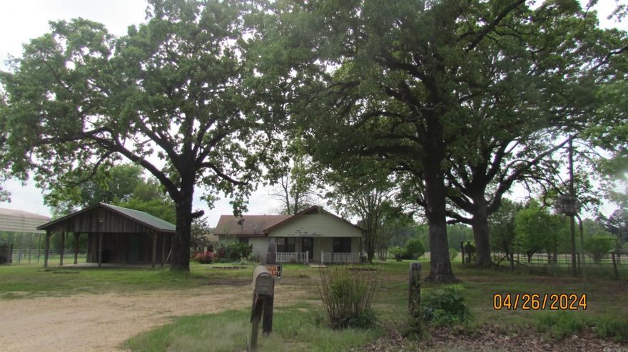 Parcel: #001-03976-00- 42.47 Acres of fenced pasture land ready for livestock, 2 ponds stocked with fish, a large wonderful shop, large lein-2, two metal carports, double carport with storage, farm house with 1480 sq ft., a cottage that could be a guest house or mother-in-law house with living area, placed plumb for kitchen, also bathroom with shower installed but never finished and hook to water and sewer, lots of movable fencing, ready for Ranch living. Property has two water meters from Fountain Hill Water, one for house, other for where trailer use to be. This is one property that you will have to see to know all the amenities. The best loan would be a farm loan for this type property because of the 42.47 Acres.