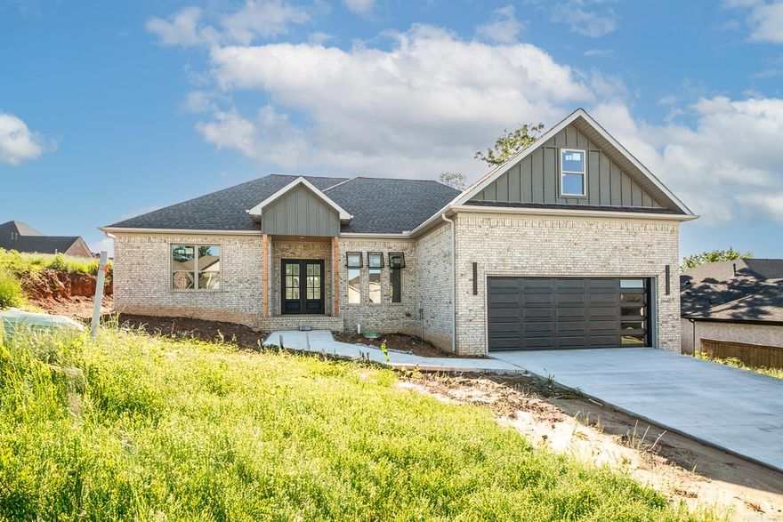 Welcome to this exquisite new construction home in Greystone Subdivision.The home boasts three and a half elegant bathrooms, highlighted by a master bath wet room with dual shower heads and a freestanding tub enclosed in glass, offering a serene spa-like retreat.The gourmet kitchen is a chef's dream, featuring a double oven, custom cabinets, and under-cabinet lighting, all accentuated by a white and gold design. The living room showcases a drop ceiling. The luxurious master suite offers two closets for ample storage, and the spacious 20-foot garage door accommodates larger vehicles and additional storage needs. Foam insulation and foil-back roof decking ensure energy efficiency, while LED lighting provides both practicality and style. The tankless hot water heater guarantees endless hot water. This home is a must-see for anyone seeking a blend of luxury, comfort, and modern amenities. Don’t miss the opportunity to make this stunning property your own; contact us today to schedule a viewing!