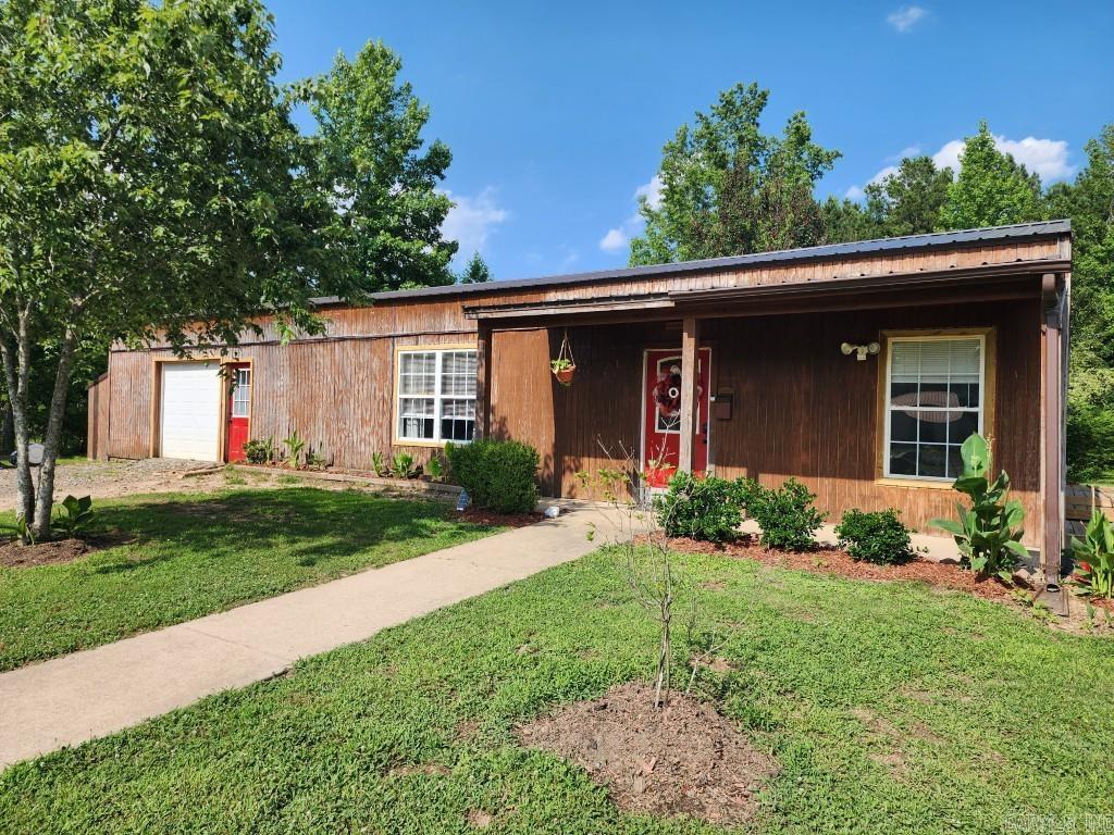 Welcome home to 21602 Buddy Drive in Hensley. This private and wooded country home sits on 5 acres! Quiet and peaceful location, yet only minutes from Little Rock amenities. Open Floor Plan with large kitchen, dining and living room combination and 9.5 foot ceilings. New metal roof 2021. New flooring. Home/property features many options for space & storage, with large closets, external storage buildings, detached 3 car covered carport, 1 car garage, plus shop and much more. Heated & Cooled, huge 1 car garage could be bonus room/office, etc. Large Workshop w/ power and water. Great opportunity for your personal oasis with space to roam. Includes 2 bdrm/1 bath detached apartment with kitchen and laundry. Well on property, but public water connected. Qualifies for Rural Development (RD) loan, with ZERO money down!