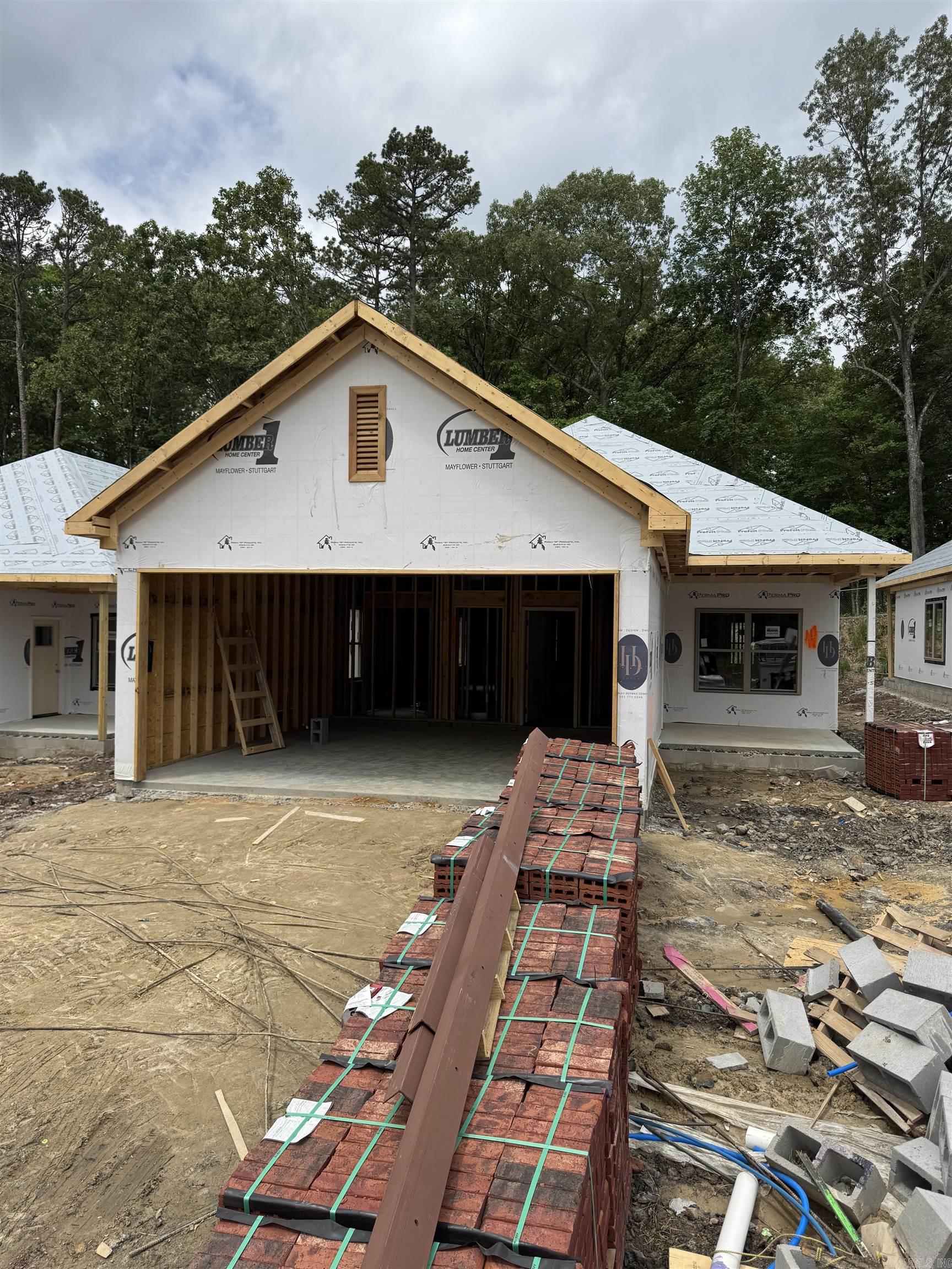 Don't miss this rare chance to own a high-quality new construction home in the heart of West Little Rock for just $325K! Currently under construction, this thoughtfully designed single-family home offers a welcoming front porch and a spacious, open floor plan perfect for both everyday living and entertaining. The highlight of the layout is the private owner's suite, quietly tucked at the rear of the home with peaceful views of mature trees. You'll love the spa-like ensuite bath featuring dual vanities and an oversized walk-in closet with ample storage. Designer-selected finishes throughout will elevate every space with modern style and comfort. Located in a prime area close to shopping, dining, and top-rated schools, this home blends convenience and charm. Estimated completion: August 2025. Act now to secure your place in this sought-after neighborhood! *Please note: Exterior rendering & interior design selections are for illustrative purposes and may not reflect all final design details. Contact the agent for confirmation and additional information.