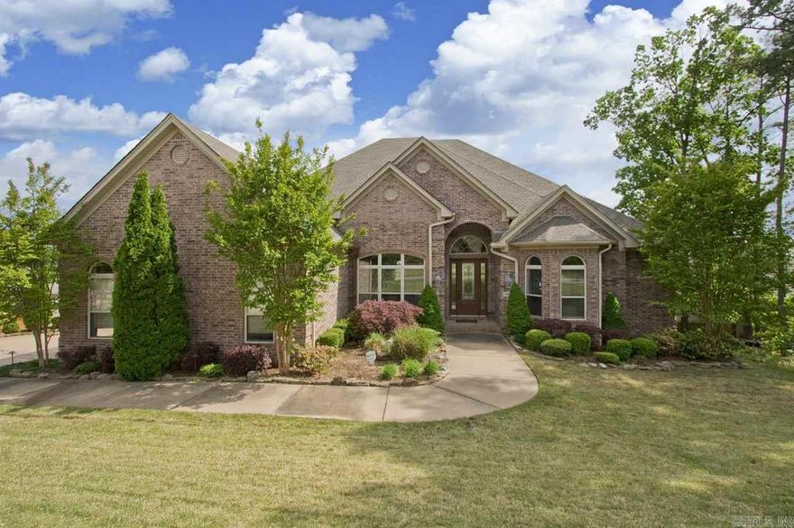 Fabulous OPEN FLOOR PLAN with 12 ft tray ceilings in GR, MSTR and DR. All Brick.  Gourmet kitchen w/ dbl ovens, Brkfst Bar, slab granite counters, beautiful stained cabinetry! Mstr on main w/ Study/4th BD along with 2 BD. Lots of built-ins and large concrete flr WORKSHOP underneath w/dbl doors! Upstairs is ROUGHED-IN 600 sqft Bonus w/ tray and vaulted ceiling! Beautiful hardwoods and lots of natural light. Large deck with covered area. Beautiful views! Agents see remarks.