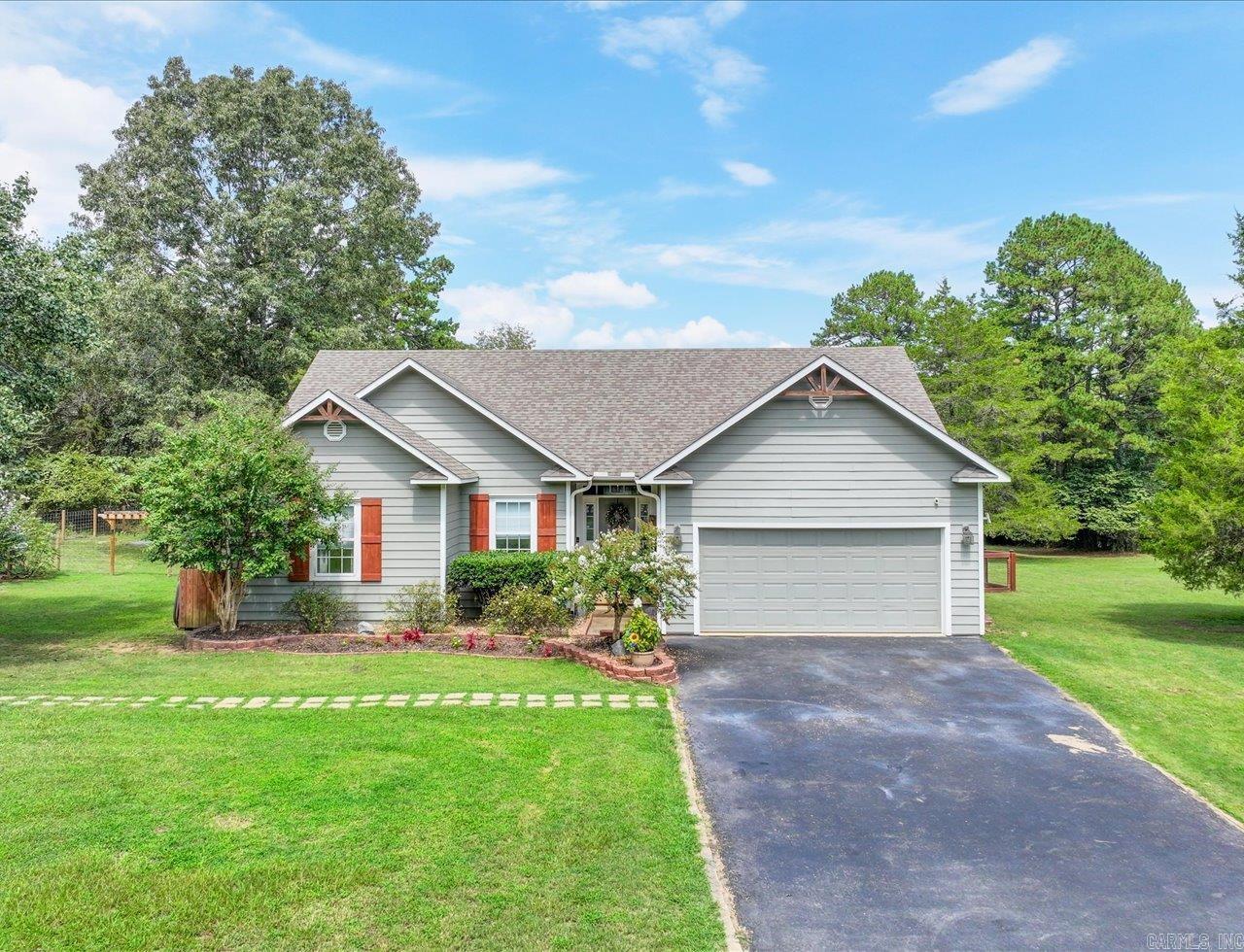 Charming 3Bd/2Ba Home on 1.54 Acres ā Lake Hamilton School District ā Outdoor Living, Chicken Coop & More! Welcome to your own slice of country paradise in Pearcy, AR! Nestled on 1.54 level acres in the highly sought-after Lake Hamilton School District, this beautifully maintained 3-bedroom, 2-bathroom home offers the perfect blend of comfort, space, and functionality. Step inside to find a warm and inviting interior with an open-concept layout, gas-log fireplace, beamed & vaulted ceiling in living area, and updated LVT flooring. The kitchen features granite countertops, stainless appliances, and custom-tile backsplash. Outside, enjoy the ultimate outdoor living space, complete with a mounted outdoor TV, perfect for watching the game or movie nights under the stars. The spacious yard is ideal for kids, pets, and gatherings ā and donāt miss the chicken coop ready for your feathered friends or homesteading dreams! With plenty of room to garden, play, or simply relax, this property offers the peace of country living just minutes from town amenities. Donāt miss your chance to own this unique property in a great location ā schedule your private showing today!