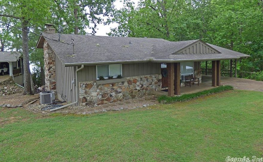 Three Bedroom House on Lake Thunderbird! This house sits on great water and features 3 bedrooms, 2 baths, spacious kitchen with beautiful cabinets, living room, bonus room downstairs with wood burning fireplace. Both bathrooms have been remodeled. Covered back deck with a great lake view. Two car carport. Situated back in a cove, perfect for swimming, fishing, paddle boarding or just laying out in the water.