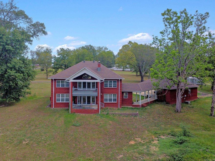 Welcome to this magnificent all-brick home that boasts a grand foyer and the perfect blend of elegance and comfort. The versatile floor plan offers a primary bedroom that can be situated on either the lower or upper level, according to your preference. Each of the spacious bedrooms have large walk in closets for abundant storage and ample additional storage areas throughout. The roomy kitchen has brand new quartz countertops and new cook top as well as double pantries. There are two laundry rooms (one on each level) and a half bath for guests on the lower level. Step outside to enjoy the tranquility of the river from either of the two back porches overlooking the backyard, with easy access to the river for endless outdoor activities. Detached garage offers space for a workshop and additional living quarters, if desired. Recent upgrades include new plantation shutters throughout the lower level and new carpeting in all bedrooms, stairs and upper living area. The home also offers both a newly installed roof and new AC unit in 2021. Would make a fantastic AirBnB! Come and experience this property on the scenic Ouachita River and make it your perfect retreat.