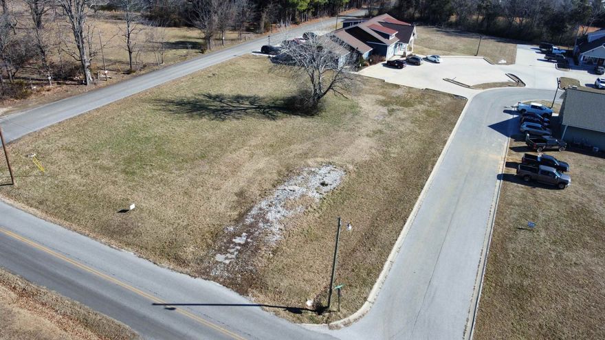 Great commercial lot with high visibility in a bustling commercial park!! There are three very well established businesses with lots of foot traffic and a built in customer base for your business. This lot has paved road access on 3 sides with Case Commons street being on the south side and the road to Mountain View school running along the West and North side so no shortage of access on this one. All utilities are available on site to make the building process as easy as possible. See Plat in pictures for lot lines. Call today and lets go take a look!!