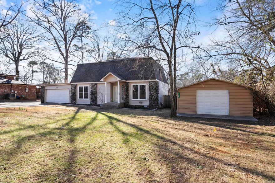 Absolutely beautiful Lake Hamilton Home. This spacious 3-bedroom, 2.5-bathroom home offers a thoughtful layout for comfortable living in the heart of Hot Springs. It features two large living areas, one with a beautiful brick fireplace, and a kitchen with stainless steel appliances and granite countertops. Upstairs, the primary suite includes its own fireplace and en-suite bathroom. Two more bedrooms and a bonus room that serves as an office, playroom, or hobby space. Situated in a peaceful setting across from the Lake Hamilton, this home offers easy access to nature, fishing, and outdoor recreation. Additional perks include an attached garage for two cars and a detached garage/shop that could be use for golf cart garage or extra storage/workspace.  Don’t miss this chance to own a home in one of Arkansas’ most charming and sought-after areas at Lake Hamilton. Schedule your showing today!