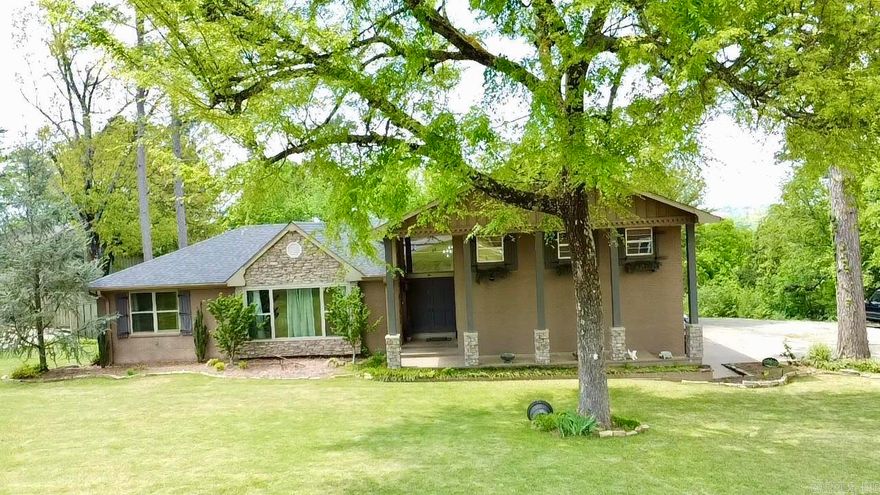 Executive-Style Home with Privacy, Space, and Views - This 4-bedroom, 2.5-bath home offers the perfect blend of comfort, style, and functionality. Surrounded by a lush lawn and established landscaping, the property welcomes you with a stunning formal foyer and a bright, airy feel enhanced by abundant natural light.  Designed for both everyday living and entertaining, the home features a formal living area along with a spacious den/family/game room anchored by a rock fireplace. The fully equipped kitchen with double pantry provides ample storage.  Recent updates include fresh interior paint, and the home has been well cared for and meticulously maintained throughout. Additional features include built-ins, a huge basement offering extensive storage, and a hot tub for relaxing evenings.  Enjoy the outdoors with a private backyard surrounded by a canopy of trees, along with distant mountain views from the sun deck. The primary suite offers its own private sun deck, overlooking the backyard and capturing those same scenic views.