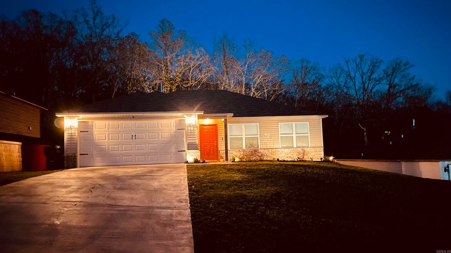 Split bedroom, open floor plan welcomes you with Luxury Vinyl Plank flooring in entry and wet areas, raised ceilings in Living Room, LED disk lights in Kitchen, stainless steel appliances. Bedrooms 2 and 3 are set to the right side of the home, one in front and one in rear with the Master Bedroom to the rear. Backs up to lot of wooded green space for added privacy. Comes with attic stairs for added storage.