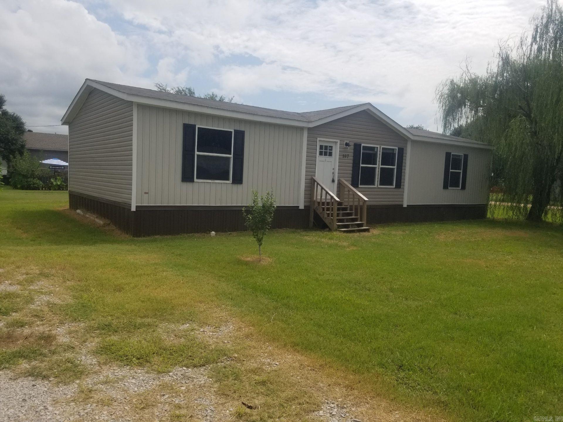 Charming 3-bedroom, 2-bath manufactured home located on a quiet street in Caraway, Craighead County. Built in 2022, this spacious home offers an open floor plan, ideal for comfortable family living. The living room flows into the kitchen with cabinet space and a convenient dining area. The primary suite features a private bathroom with soaking tub and walk-in closet. Two additional bedrooms and a full bath provide plenty of room for guests or a growing family. Situated on a generous lot with room for outdoor activities. Don't miss this affordable, move-in ready home!