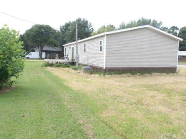 Charming 3-bedroom, 2-bath manufactured home located on a quiet street in Caraway, Craighead County. Built in 2022, this spacious home offers an open floor plan, ideal for comfortable family living. The living room flows into the kitchen with cabinet space and a convenient dining area. The primary suite features a private bathroom with soaking tub and walk-in closet. Two additional bedrooms and a full bath provide plenty of room for guests or a growing family. Situated on a generous lot with room for outdoor activities. Don't miss this affordable, move-in ready home!