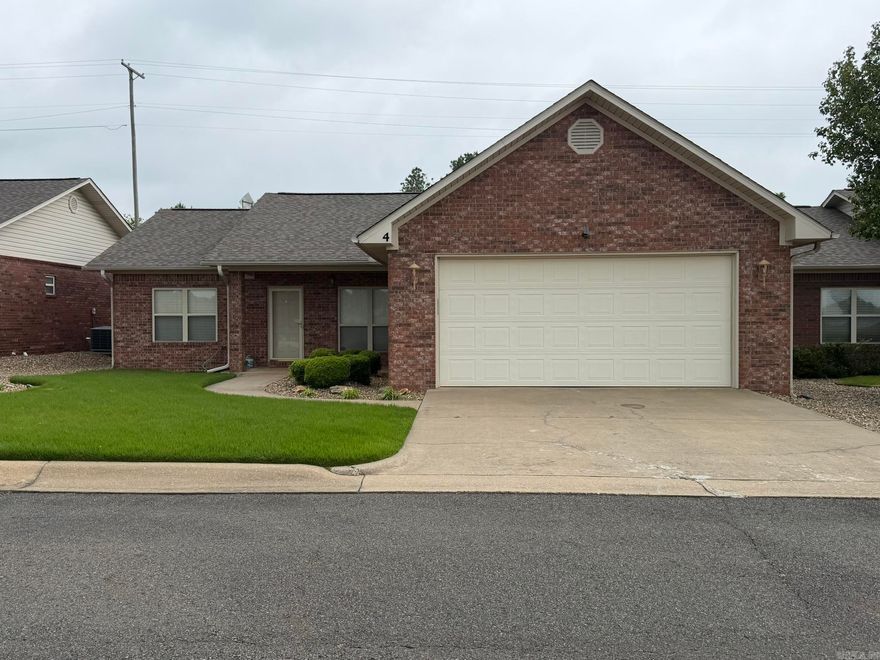 Low maintenance living at its finest. This home offers a great location at the front of the subdivision. Easy parking w/ front entry garage. Very well maintained home. Split bedroom plan w/ 2 living areas, kitchen/eating in the center of the home. Wood floors through living & bedrooms, tile in wet areas. Seller updated shower doors to glass sliders just recently. Main suite has plenty of space for your king furniture. The en-suite bath is spacious w/ a walk-in shower & a huge walk-in closet. Big enought o share, if you have to. Both guest bedrooms are roomy enough & each have a nice closet with built-ins. The kitchen features: beautiful wood cabinets, granite countertops, a small pantry, refrigerator, stove, microwave & dishwasher. A nice sliding door opens from the eating area to the patio space. Great for outdoor entertaining. There is more storage with a larger walk-in pantry just off the kitchen near the laundry area. Talk about storage! The full staircase to the over garage floor attic space is amazing. There is even a walkway for the service guys to get to the furnace. The 50 gallon, electric water heater is located inside by the washer/dryer.  Located in a Senior Community.