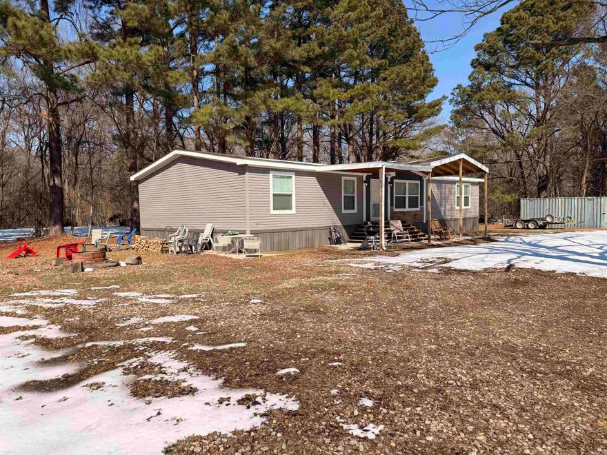 Welcome to the Drop Tine camps at Georgetown, Arkansas. Georgetown sits on the banks of the White River in one of the best waterfowl and trophy whitetail areas in the state.  Aside from the private lands, you are less than 20 minutes from both Hurricane and Raft Creek WMA's. Sitting on the same 2.2 +/- acre lot is a 2022 model 30'x68' manufactured home that has an excellent layout and includes 4 bedrooms and 2 full bathrooms.  It is a split layout with a master on one end and 3 beds/1 bath on the opposite end.  Additionally, there is a 2010 model 16'x50' mobile that offers an additional 2 bed/1 bath of nice living space.  So, whether two families go together or if you simply keep the nice home for yourself and allow your guests to stay in the smaller space, this setup is well suited to entertain both family and friends for many years to come.  There is a 63 +/- acre bottomland timber tract just 1 mile up Jones Island Road and bordering the Raft Creek WMA that is available by this same seller should you want to package that with this camp to have your own private land for duck, deer, and turkey hunting.  This camp is selling mostly furnished.