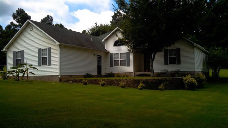 This well kept home in the Brookland School district, sits in the middle of its large, beautiful lot, has 1623 square feet, and offers a country setting. There is a very nice 40 by 30 workshop behind this home that has electric, lighting, and wiring throughout. There is also a 2 car garage on the home. The inside has mostly pristine wood laminate flooring, except the kitchen and bathroom areas in which they are ceramic tile. There is enough matching wood laminate, new in the box that goes with the home.