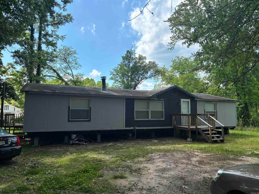 Calling all investors! 406 Happy St offers a value-add opportunity with a 3-bedroom, 2-bath manufactured home featuring approximately 1,568 square feet. Renovations have been started, allowing the next owner to complete the project and build equity. Situated on a corner lot with public water and sewer, this property has solid potential as a rental, or affordable owner-occupant home. Conveniently located in Malvern with easy access to schools, shopping, and major roadways. Sold as-is; bring your tools and imagination. Very little left to do.
