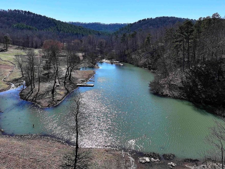 UNIQUE 90± ACRE campground with a max capacity for 300 guests is buffered by Ouachita National Forest on 3 sides. Easy access to Wolf Pen Gap ATV Trails. The facility features 9 fully insulated cabins with separate heating/air condition and bathrooms in each. The caretaker's home has 3 br, 2 bath and is all electric. Other features include spacious dining hall, conference center, shower & restroom building, lodge, outdoor tabernacle, 28X60 commercial swimming pool, pool house and concession building, basketball court, playground, 18-hole mini golf course, RV, camper, and tent hookups, outdoor lake for fishing & swimming, on site water treatment, water tower (not in use at this time), and so much more! Currently used as a church camp, the property offers endless opportunities to fit your needs!
