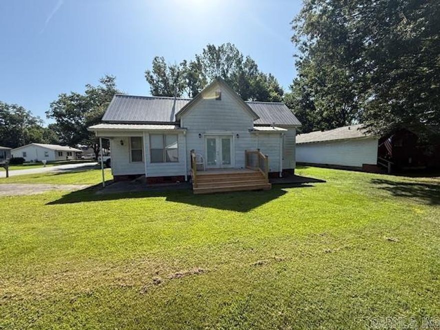 This beautifully updated 2-bedroom, 1-bath home offers modern comfort and style on a serene, tree shaded corner lot. Enjoy an open-concept kitchen and dining area featuring brand new cabinets and sleek granite countertops, perfect for entertaining. Recent updates include new flooring, fresh interior paint, energy efficient AC, and new gutters. Located in the heart of Carlisle, this move in ready gem blends convenience, charm, and contemporary updates. Don't miss your chance to make it yours.