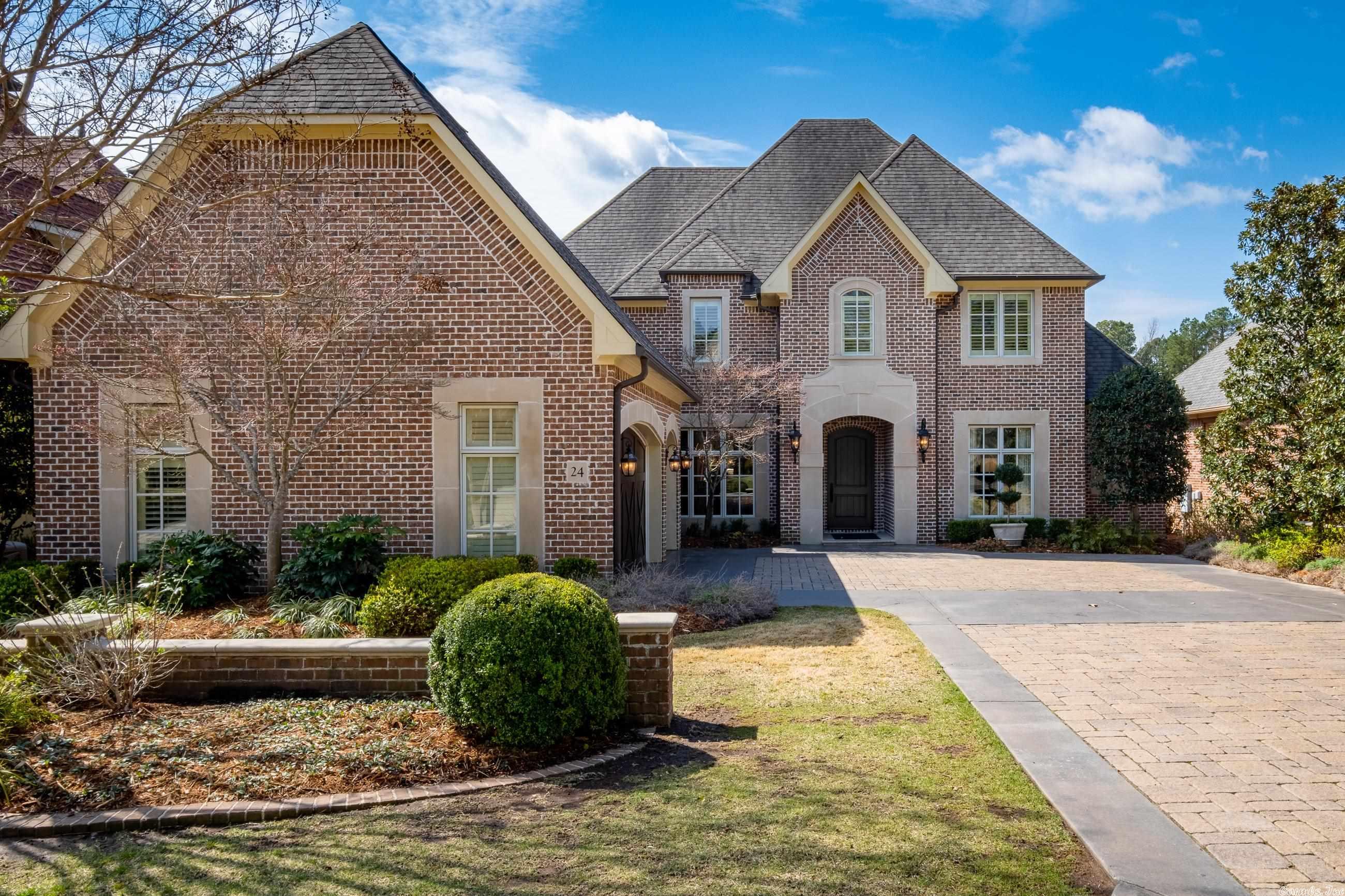 Exquisite home with beautiful finishes and details thru-out. Stunning travertine floors, Handsome study with built-ins, formal and informal dining areas and great room opening to covered veranda. Gourmet kitchen with top of the line appliances and cozy hearth room. Luxurious primary suite on the main level with gorgeous spa bath. Two/Three bedrooms upstairs + media/theater room w/wet bar. Third bedroom opens to covered balcony. Relaxing flagstone courtyard w/outdoor kitchen and fireplace. Come See!