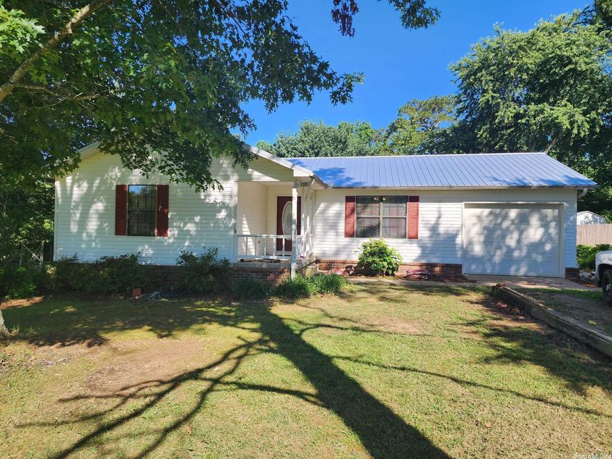 This cozy but private 3 bed, 2 bath house with garage is located on 2.03 acres & has plenty of storage including a 24x24 shed, 8x10 & 8X12 storage buildings. The yard has blueberries, pear cherry apple & peach trees. NEW MERAL ROOF IN 2023. It also has central heat & air, separate laundry room, refrigerator, insulated windows & a 12x12 covered back deck to enjoy your morning coffee. See remarks!