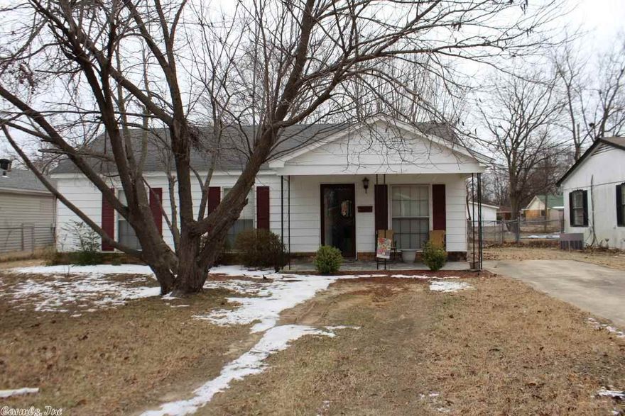 This property is a charming home in the heart of town. This home would make a great starter home. The cozy family room has new wood laminate flooring and a neutral color scheme. The eat-in kitchen features new flooring, oak cabinetry and a dishwasher. There is a large master bedroom with wood laminate flooring. Additional bedrooms have plush neutral carpeting. Other amenities of this home include a covered porch, a fenced yard and a large laundry room with extra storage.