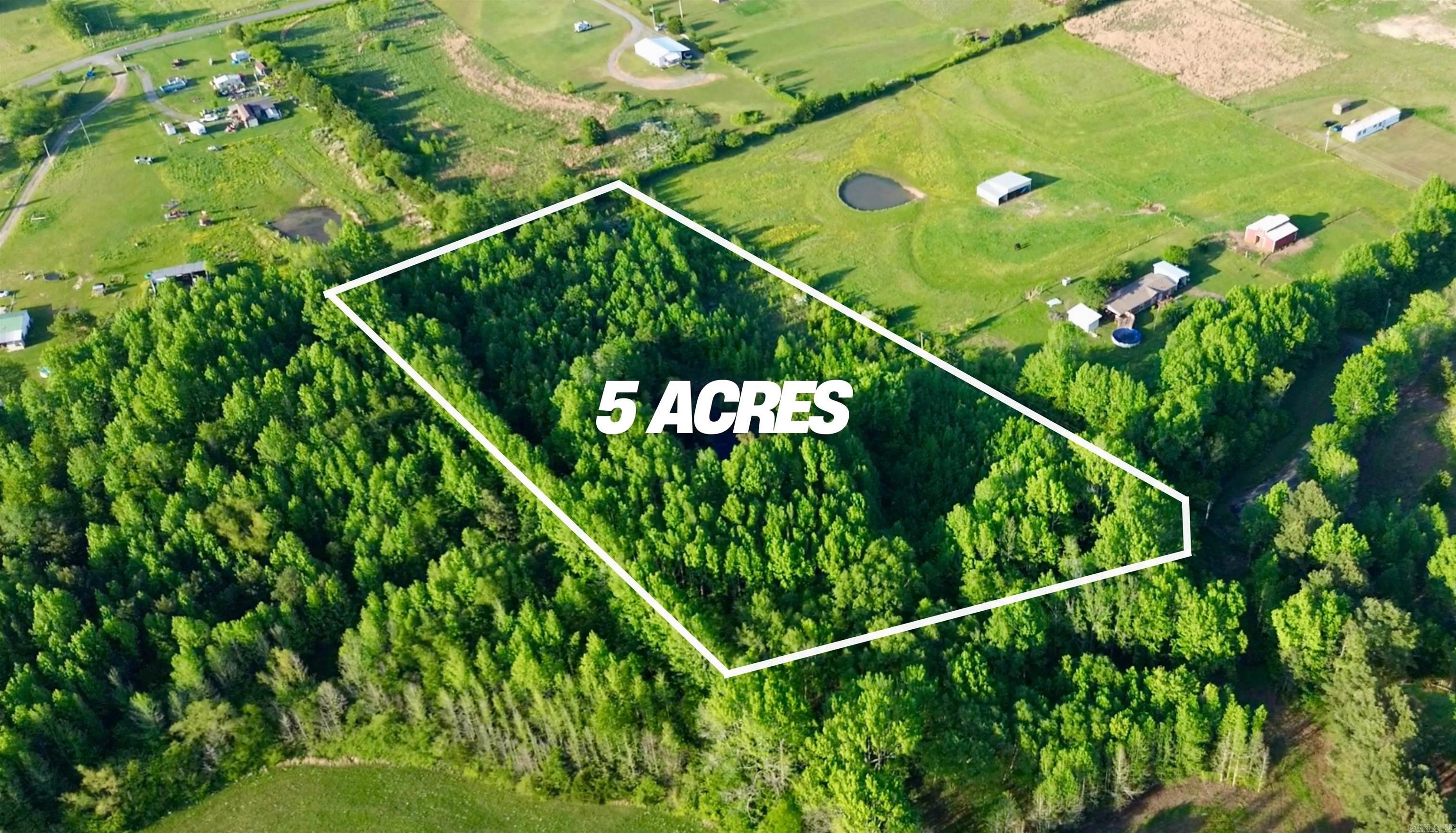If you are looking for a peaceful piece of land to build your dream home, look no further than this 5-acre tract in the Guy Perkins School District. You are only about 9 minutes from the middle of Greenbrier, but completely in the country! At one point there was a mobile home on the lot, so utilities were present. Mostly wooded with a nice pond, this property has all the things that would make it a perfect home place for your family to get outdoors and have room to explore! See agent remarks.