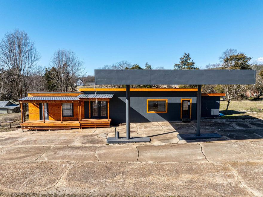 Welcome to the market this beautifully restored multi use building in Evening Shade Arkansas sitting on appx half an Acre! Conveniently located right on Hwy 167, this building could be used for an office space, small residence or a combination of both! Currently in use as an office space with living quarters, this log and block building has beautiful new wood ceilings and new painted sheetrock walls making the combination warm and inviting. Sliding wood barn doors separate the living and kitchen areas from the full bathroom with tiled shower and surprisingly large bedroom. The bedroom is large enough to hold multiple beds. White appliances and white cabinets give the kitchen a modern feel and make a nice accent to the wood walls and countertop. The living room is centrally located and has also been used for meetings and trainings. All electric and plumbing is either new or updated as well! Equipped with fiber internet you will already be set for working from here and running multiple devices and computers! This building can be used for just about anything and is priced to sell!