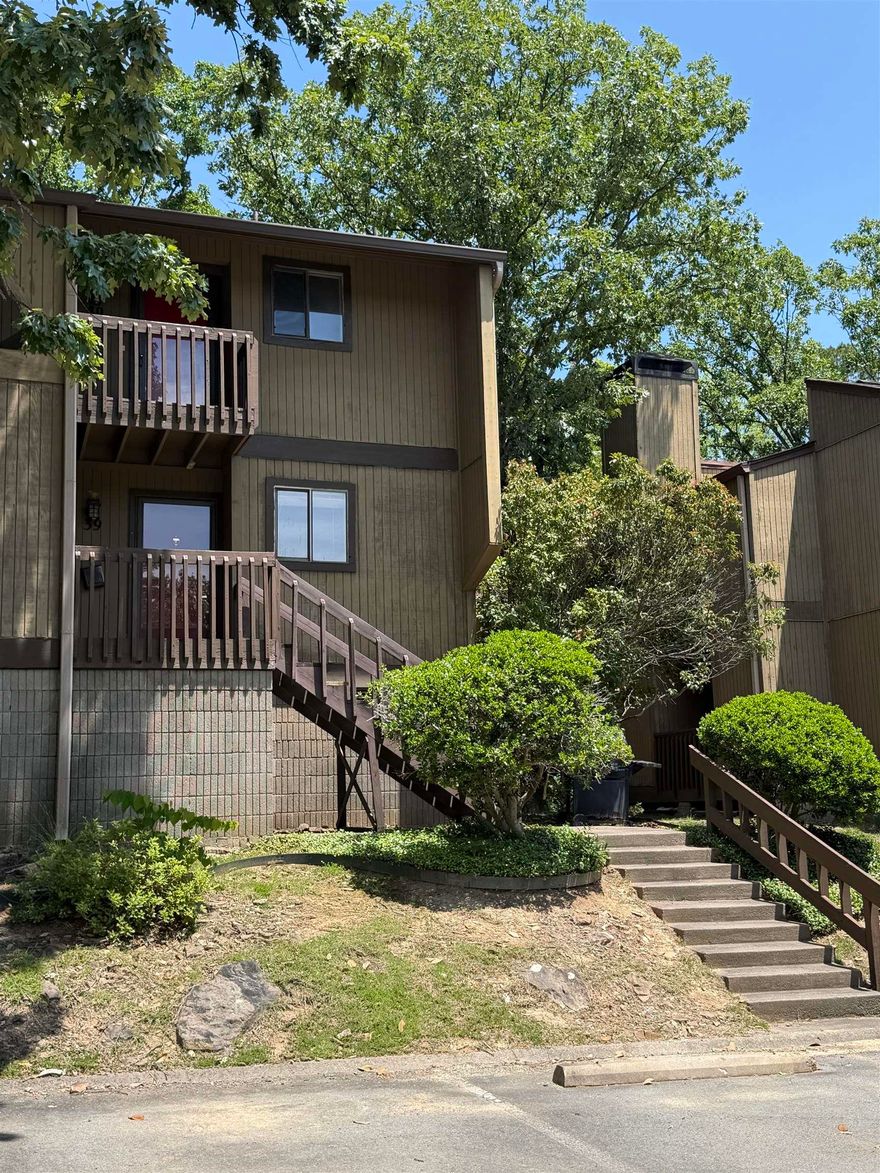 GREAT VIEW and central location.  2 bed 2 bath ready to move in condo directly overlooking the tree filled courtyard and pool.  Probably the best unit in the complex. 1 assigned parking spot directly in front of this unit and plenty of guest parking.  2 balconies, plenty of shade, outside storage. Mostly furnished and includes washer & dryer & fridge.  Granite kitchen counters. Walk in shower in primary with fold out wood seat. LVP flooring throughout so no carpet!  Nice wood burning fireplace for winter nights! Easy living. HOA fee includes water, sewer, & trash, so all you pay is electric and internet (usually very cheap). See agent remarks.
