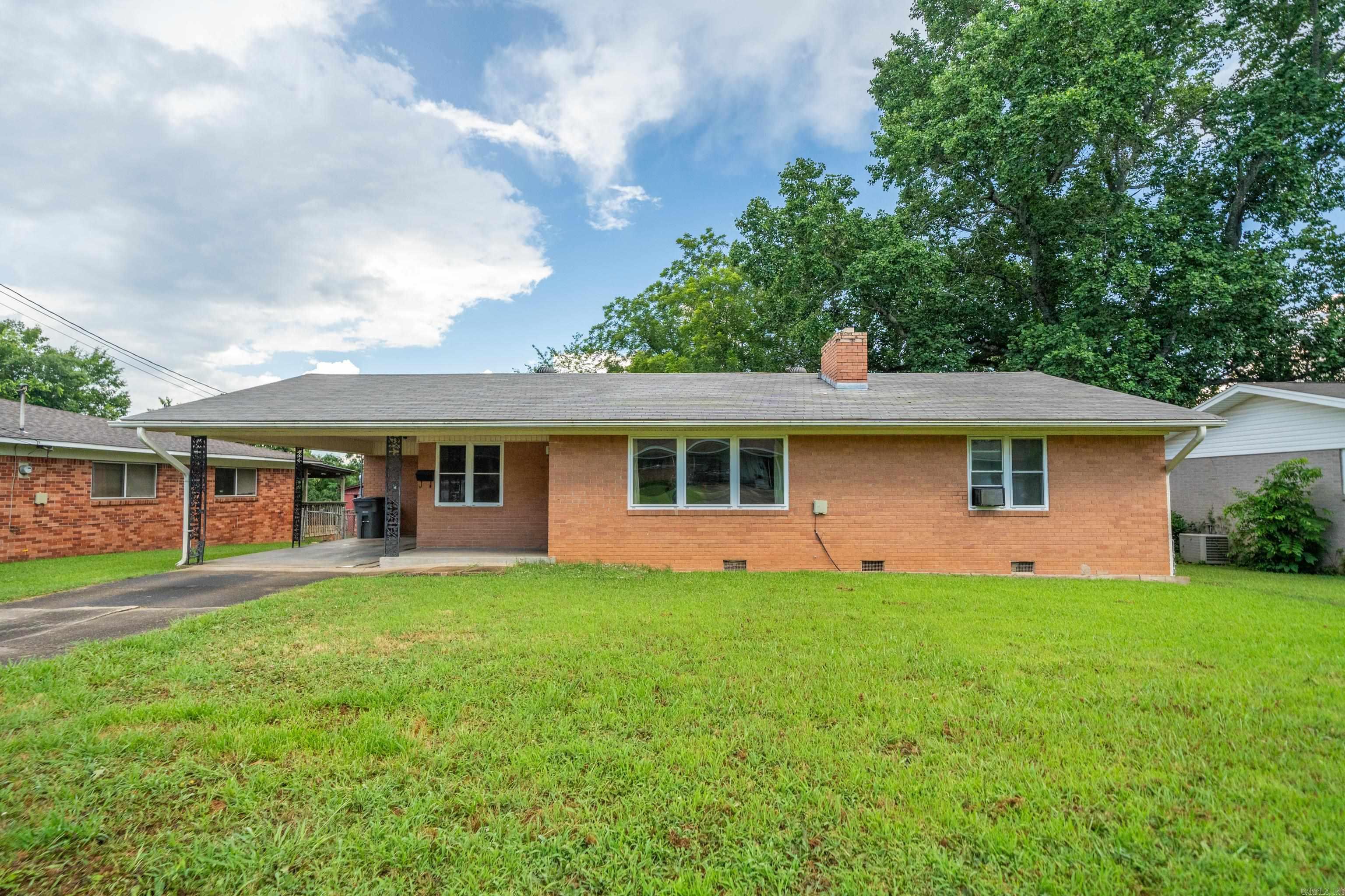 Discover the charm and potential of this 3-bedroom, 1.5-bath ranch-style brick home, ideally located in the heart of Hot Springs, AR. This solid, single-level residence offers timeless appeal, making it a fantastic opportunity for homeowners or investors alike. Step inside to find original hardwood floors throughout much of the homeājust waiting to be refinished to their natural beauty. Newer vinyl windows provide improved energy efficiency and fill the living spaces with natural light. Enjoy a functional layout that includes three spacious bedrooms, a full bathroom, and an additional half bath for added convenience. Outside, a one-car carport provides covered parking, while the fenced backyard offers the perfect space for pets, play, or outdoor entertaining. Close to shopping, restaurants, and local amenities, this home delivers both comfort and convenience. Whether you're looking for your first home, downsizing, or searching for a rental property, this gem offers endless potential.