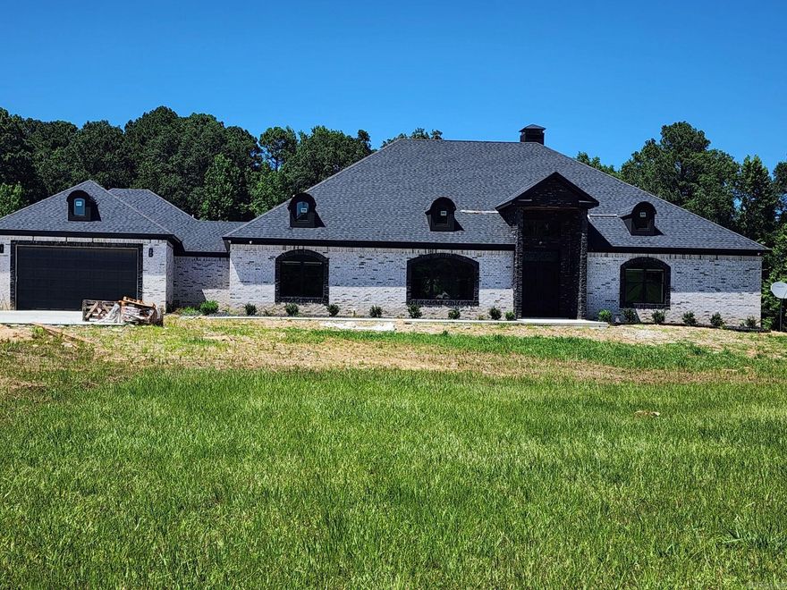 Beautiful custom built home. 4,914 sqft of privacy that sits on 6.03 acres. Minutes from downtown Little Rock. 4 car garage ( front load & side load), large patio with remote control screens to enjoy enclosed or open. Patio area features 1/2 bath, outdoor kitchen and a separate grill area. Mud Room. Living area that features a large wall wine cabinet along side of the wood burning fireplace. Tornado/storm shelter located in a secluded room. Large laundry room with 2 washers and 2 dryers. Office could be used as a 4th bedroom. This beauty has to many features to name.