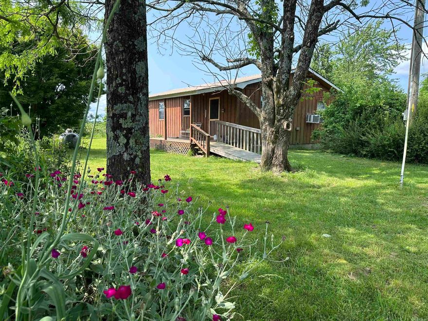 This beautiful 40 acre +/-property offers a rare blend of functionality and natural beauty. It features a home with shop, two wells, a pond, and access to both city water and high-speed fiber internet. The land includes productive pasture, a hay field, a garden area, and a mix of open and wooded ground, perfect for recreation or homesteading. A creek, natural springs, and scenic bluff overhangs add to the charm and character of the land. With paved Highway 27 frontage, easy access is a bonus, and the abundant wildlife makes it ideal for hunting and outdoor enjoyment.