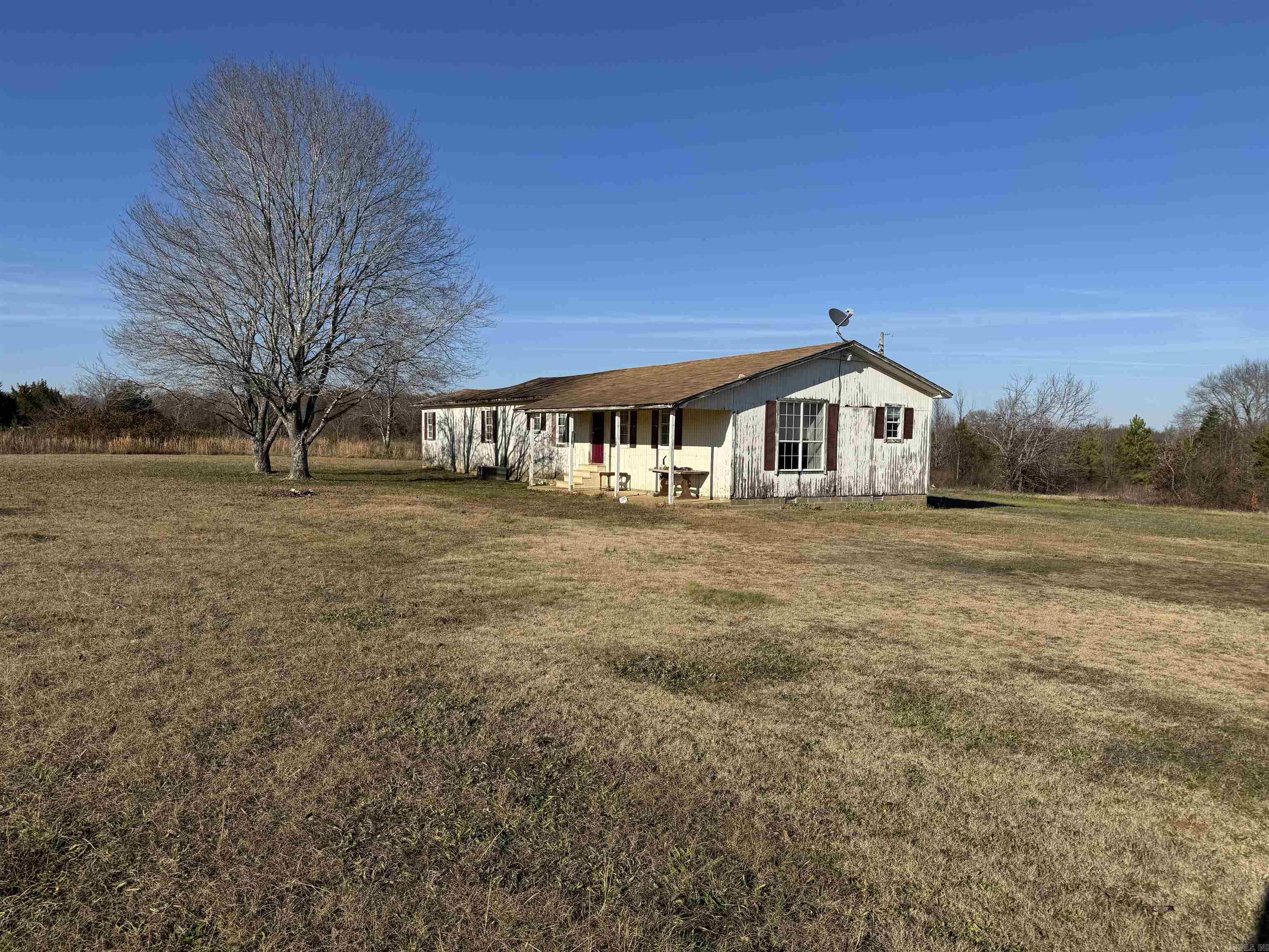 Attention Investors! This is a great fixer-upper that would make someone an excellent investment property. Located on a paved road in a growing area, it wouldn't take much to get this thing up to snuff and make a little money. Come check it out.