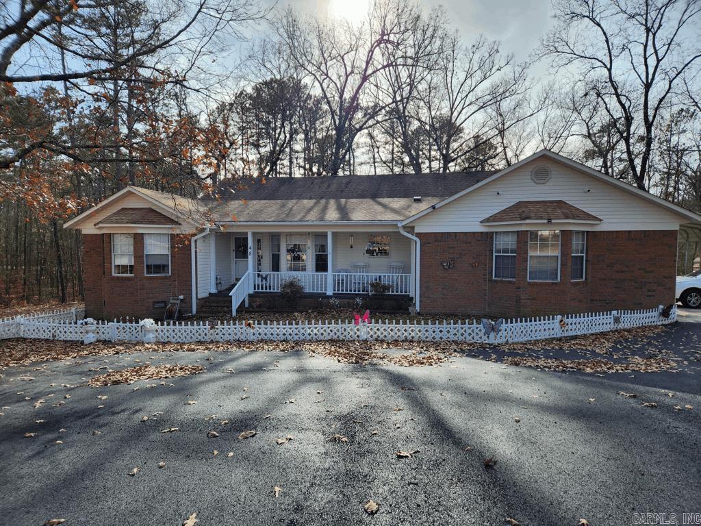Make an offer. 2 bedroom, 2 bath brick home on Twin Creeks Road in Mount Ida AR. This house is in a great location. It is just about one mile to Lake Ouachita's Twin Creek boat ramp. It has a car garage for storing your boat and toys. Also features a 12x20 metal carport and a 17x25 metal RV carport. The driveway is paved, there is a chainlink fence in the back to keep in your dogs. The back deck has extra supports and wiring for a hot tub. Inside this 1637 sq ft home is a wood burning insert, laundry room, 13x11 sunroom, cozy kitchen, and a large primary bedroom and bath. Washer, dryer, and fridge and a generator convey. All sitting on 2.17 acres. Great family getaway.