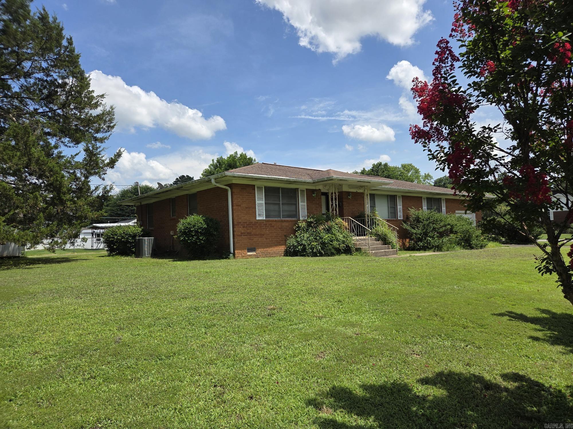 Large 2 bed, 2 bath house in established neighborhood that could use the separate dining as a 3rd bedroom. It has a unfinished basement with inside & outside access & serves as a saferoom. The 12 x 25 aluminum covered patio is great for relaxing. It features a double-sided accent fireplace that faces the two living areas but could easily drop an unvented gas log insert if new owner wanted to make it functional. Crown molding on most all ceilings. Pocket doors to both sides of separate dining & both baths. Large separate laundry room. The Trane HVAC was installed 6 years ago so should still be under warranty. Appointment required, see agent remarks.