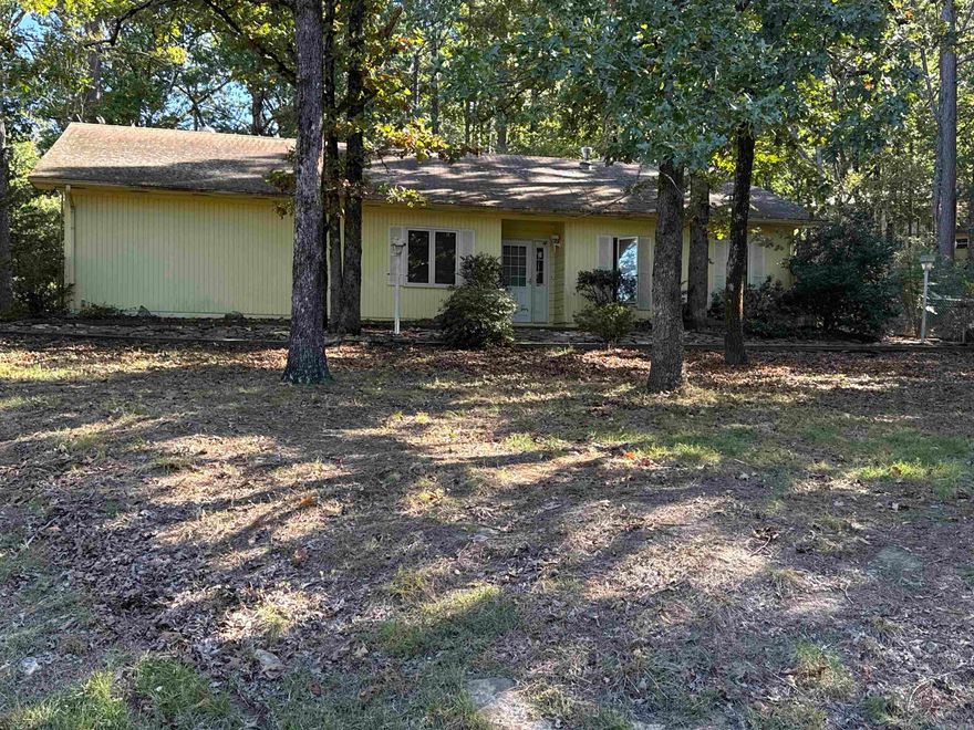 ATTENTION INVESTORS AND FIXER-UPPERS looking for a well-built home to update. Priced to allow you to make it your own residence or to rent. All 3 BR are separate, one could be used as an office or studio!!  Primary BR has 3/4 bath. The second bath is in a central hall. You’ll be impressed with the living/dining/kitchen space, plus a large pantry, another storage room, separate laundry room & extra closets. Step out to a glass enclosed patio. The driveway provides for several vehicles, and a double garage has plenty of room. The back yard is partially fenced with 4’ chain link fencing. The central location is 1 block from the Bayview Pool, Cool Pool Cafe, pickleball and tennis courts. Walking distance to shopping, restaurants, bank, park and minigolf, and other amenities and businesses. Ownership gives you access to all Fairfield Bay Resort amenities. Ask about the dues and other fees!!  The sale of the property is subject to court approval. It is being sold AS IS, and no disclosures are provided. AR