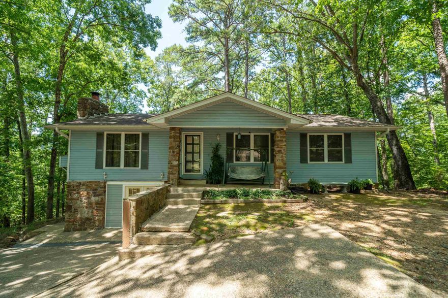 Nestled in a peaceful, wooded setting of Diamondhead Golf & Gated Community, This 3 bedroom 2 bath home offers the perfect blend of privacy & comfort. Step inside to a spacious layout & inviting living spaces, ideal for entertaining. The finished basement adds valuable extra living space for a game room or an office. Enjoy the privacy of the large deck overlooking the peaceful wooded backyard. The community offers a golf course, tennis courts, swimming pool, club house, restaurant, marina & lake access. **The 1896 sqft includes the finished basement/gameroom. Sqft per seller