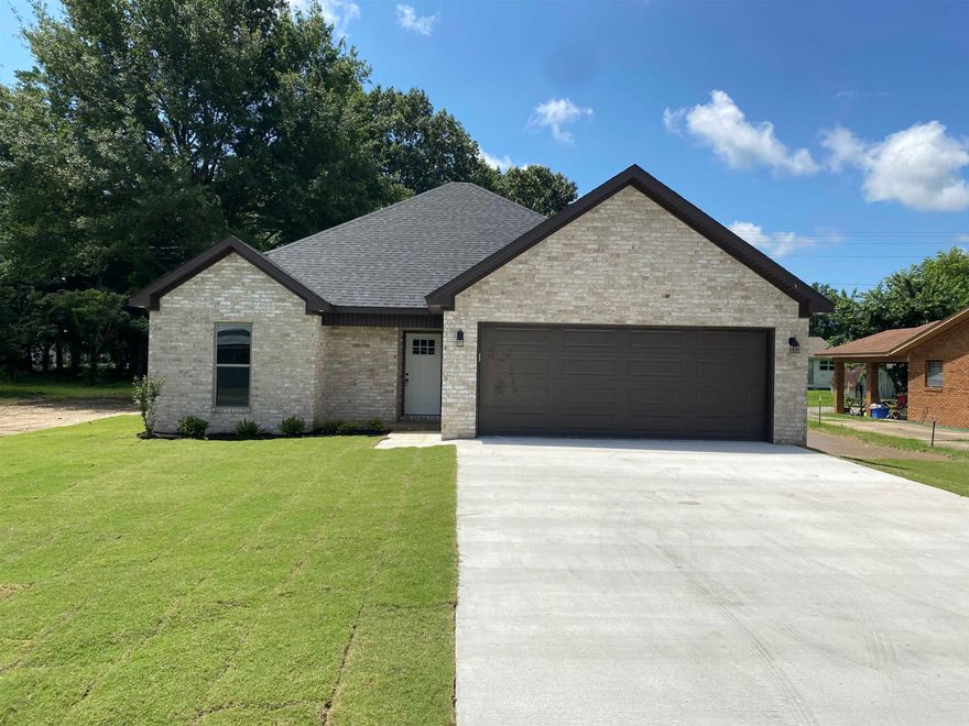 New brick beauty located in a fantastic, well established neighborhood, not in flood zone. 3 bedroom, 2 bath with vaulted ceiling and gas log fireplace in the living. Eat-in kitchen with corner sink. Wood look ceramic tile throughout. His/her closets in the primary bathroom. 2-car garage with front and back porch. Jonesboro Arkansas is a short 15 minute drive, Memphis is about an hour away. Plan to make 231 Flossie Trumann AR your next home.