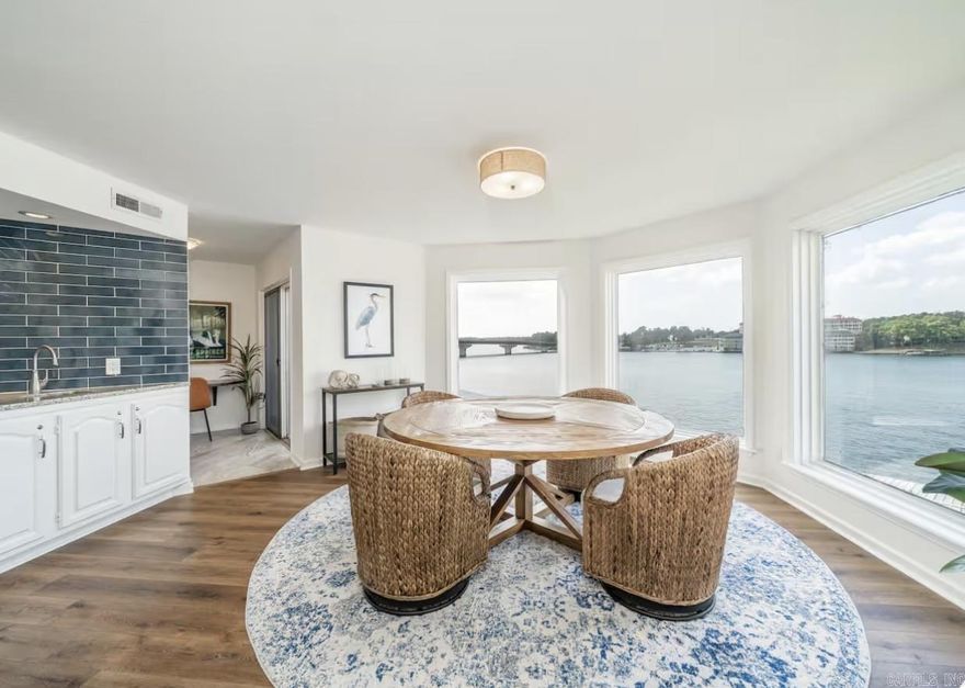 Bring your boat! This fully furnished, move-in ready condo offers the ultimate lakefront lifestyle. Perfectly positioned in the heart of it all, you’ll enjoy breathtaking 180° views of Lake Hamilton right from your own balcony. Inside, the condo features stylish modern décor and a comfortable, inviting layout. Its prime location puts you just minutes from Oaklawn Racing Casino Resort, dining, shopping, art galleries, movie theaters, and endless outdoor recreation. A private boat dock provides effortless access to the water, making it easy to spend your days on the lake and your evenings unwinding with stunning sunset views. Residents also enjoy exceptional POA amenities, including a swimming pool, hot tub, clubhouse, and the added peace of mind of a gated community.
