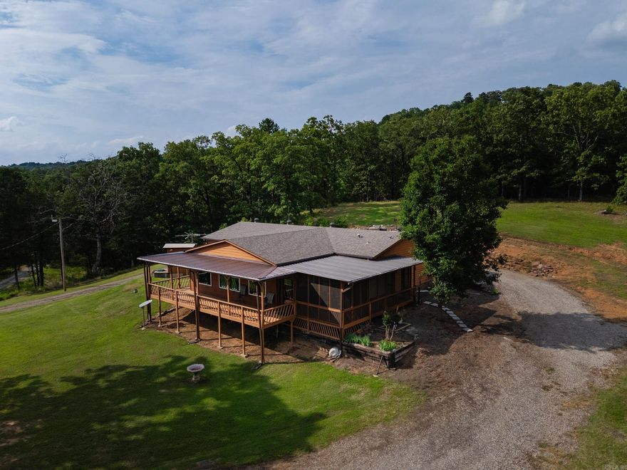 Welcome to your private slice of the country! This inviting 3-bedroom, 2-bath manufactured home sits on 44± beautiful acres and offers peaceful living with plenty of room to roam. Enjoy morning coffee or evening sunsets from the cozy sunroom, where you can soak in the serene views of the Arkansas River. A large shop, detached garage, and storm shelter add comfort, security, and convenience. The property also includes a shale pit, offering even more versatility and potential. Whether you're exploring the land, watching wildlife, or just relaxing by the water, this property offers the perfect setting to unwind and enjoy nature. Don’t miss the chance to make this charming, river-view retreat your own!