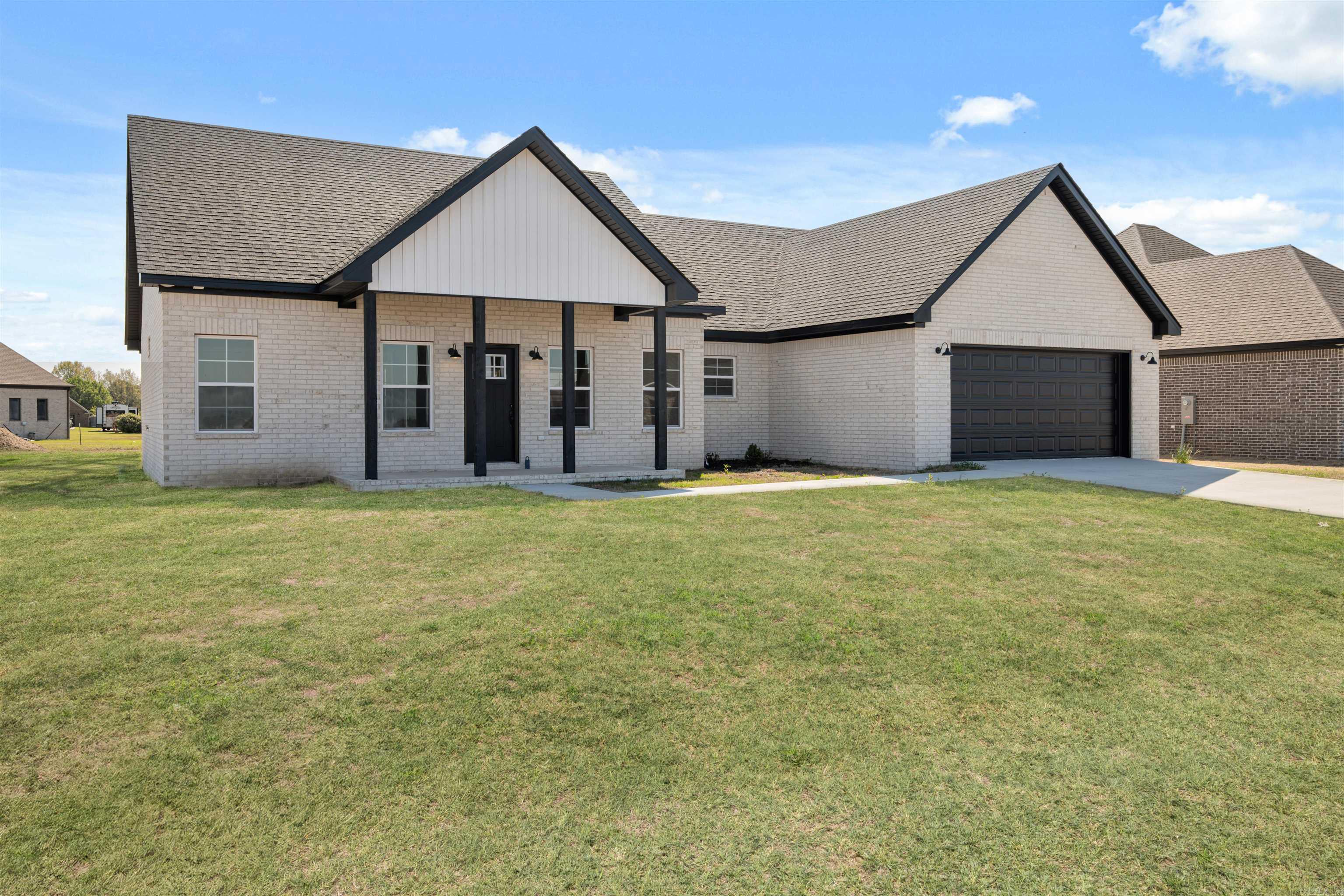 The NEW CONSTRUCTION is now complete & the appraiser has measured a final 1812 square feet!! By using the builder's preferred lender, he is offering 5.25% financing to qualified buyers. This 3 bedroom, 2 bathroom home is located in the brand new subdivision Pintail Pointe. The Del Mead White brick is crisp and beautiful next to the dark accents of the cedar columns, black roof, and black garage. The white cabinets, granite countertops with a breakfast bar, and luxury vinyl plank flooring are sure to give the open interior just the right amount of glam to catch your eye! The oversized laundry room with built in shelving and a separate butlers pantry, make the storage space in this home is amazing! Does your employer participate in the Mississippi County Work-Here, Live-Here program? This home qualifies for 10% of the sales price towards helping with your home buying expenses. That's over $30,000 towards helping with out of pocket costs if you qualify!! There are many loan programs for the Mississippi County area including help with down payment or no down payment solutions! Finding out what program best fits your needs is the first step to getting you into your NEW HOME!