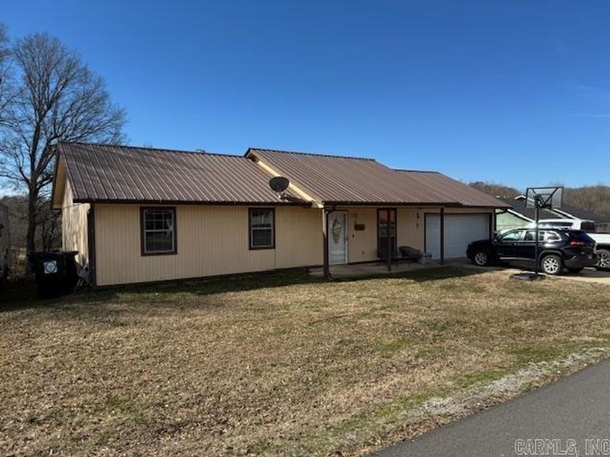 NICE 3BR, 2BA W/GARAGE!!  This home is very clean and very nice and priced to sell fast! Home has living room, kitchen, dining combo. 3 bedrooms and 2 bathrooms including a master suite with private bath and closet. Features laundry closet, 2 car garage, LVP, 2 year old central heat and air, lots of cabinets and pantry and a metal roof. Kitchen appliances included are stove, refrigerator, microwave, dishwasher and garbage disposal. Built in 2000 with 1092 square feet of living space plus 465 square foot garage. Sitting on .33 of an acre on a nice quiet street!