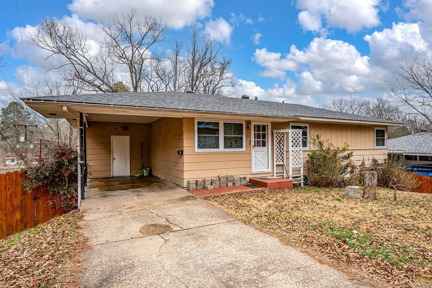 Cute house with great space.  3 bedrooms on main level.  Downstairs has bedroom, bath and it's own living area.  Perfect for teenager, in-law or bring in a tenant.  Windows have been updated.  Hurry to see it!