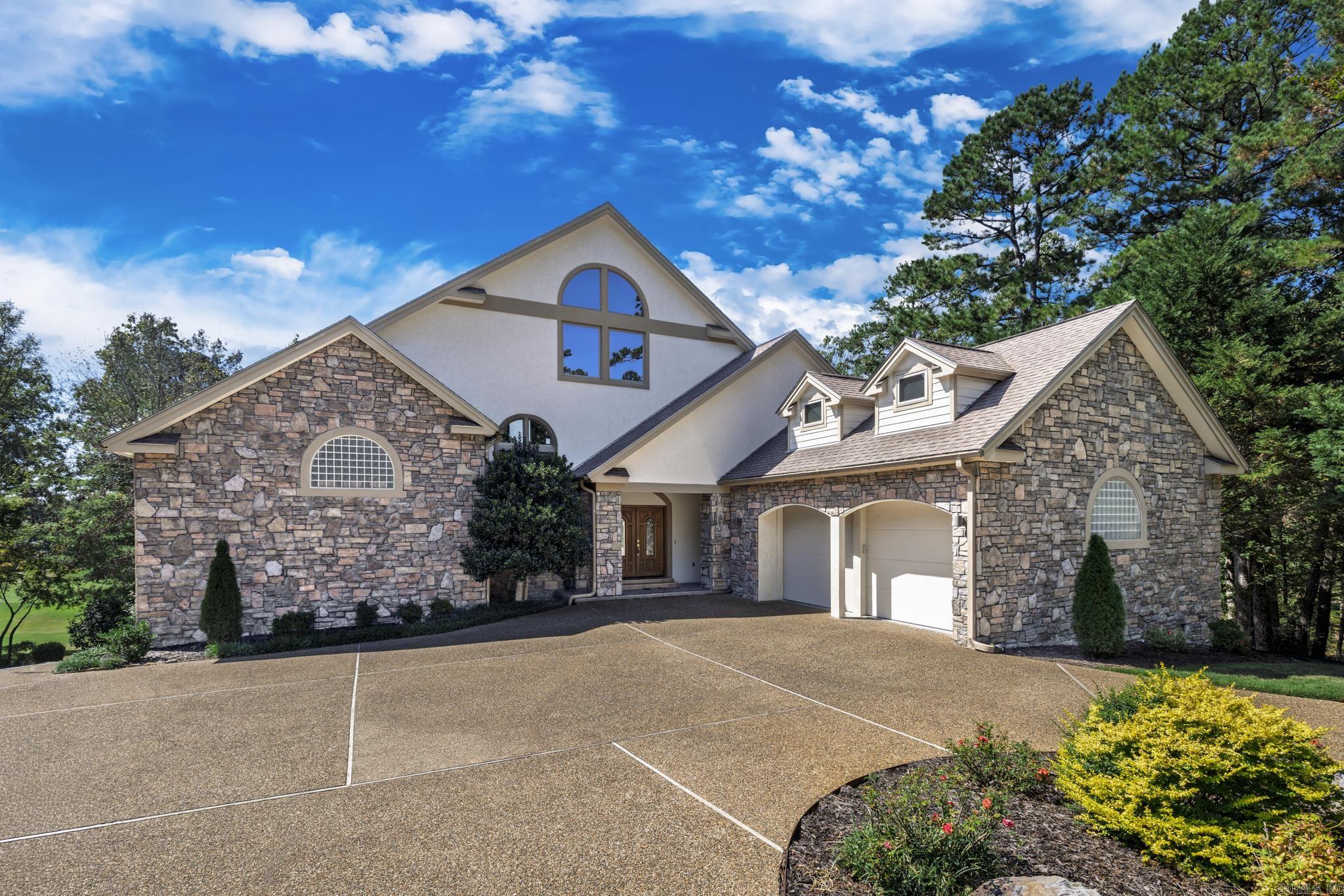 3.375% ASSUMABLE LOAN. LUXURY beyond belief. DOUGLAS FIR trim w tendon/mortise joints. DOUGLAS FIR trim on windows & flooring floor molding. Solid BIRCH cabinets throughout kitchen, pantry & bathroom. Lighted SOLID BIRCH seating bench in billiard area w billiard equipment storage & library seating. House construction is SIPS - structurally insulated panels - providing superior insulation & improved stability. BURIED 500-gallon propane tank. 2 fireplaces w propane logs. GENERAC backup generator. 12v COVE LIGHTING 34-foot ceilings. Over 500 sq ft BRAZILIAN TEAK wood deck -- fire & termite proof. Tongue-and-groove deck CEILING is CYPRESS. GAZEBO has 5-person hot tub and redwood privacy shutters. RECIRCULATING PUMP for 'no delay' hot water throughout house. Primary bath offers commercial-sized STEAM ROOM w waterfall & fiber optic lighting. JACUZZI TUB in primary bath. Central VACUUM system. FIREWOOD PIZZA OVEN. Fenced grass patio w FIRE PIT. Mostly furnished includes player piano (needs repair). Large CIRCULAR DRIVE w separate parking space for ease of entrance & exit. Dedicated concrete GOLF CART PATH leads to enclosed room w electric overhead door opener.