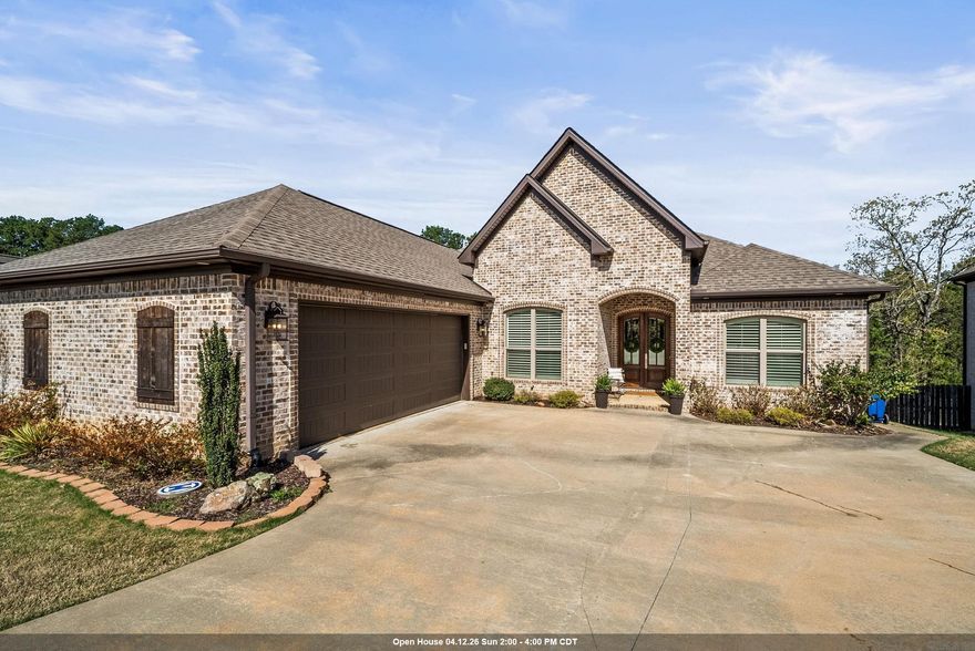 Welcome Home.  This stunning 2018 custom-built home welcomes you with a classic light brick exterior, arched entryway, and elegant double doors that hint at the beauty within. Inside, an open floor plan flows around a dramatic whitewashed brick fireplace, rich wood-look tile, plantation shutters, and crown molding - every detail thoughtfully designed. The chef's kitchen stuns with white cabinetry, bronze pendant lighting, a pantry with outlets, and stainless appliances. A sun-filled dining area and charming barn door leading to a private office round out the heart of the home.  The oversized primary suite offers a tray ceiling, ensuite bath, and a direct connection to the laundry and mudroom — a layout built for real life. Two additional bedrooms and two full baths, one being an ensuite, provide room for everyone. The crown jewel? A sprawling covered patio overlooking a fully fenced, wooded backyard — the perfect Arkansas backdrop for entertaining or unwinding. Add in a tankless water heater, side-entry garage, and a location minutes from Maumelle Charter School, and this 2,388 sq ft gem is truly one of a kind.