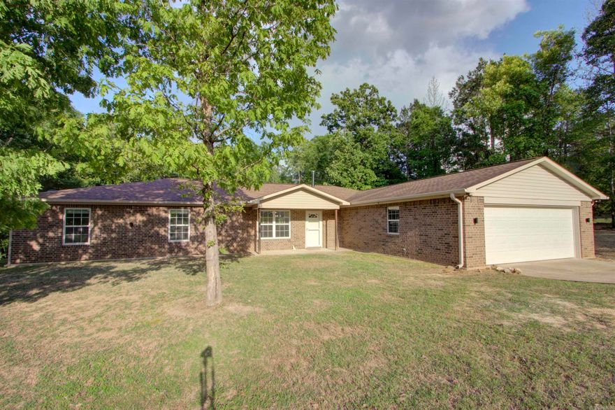 Rare find, this home is in Genoa School District & Texarkana AR city limits. If you are looking for a lease home in Genoa ISD & would like to be exempt from AR State income taxes (who wouldn't), or just in the market for a beautiful home then look no further. This home has everything. This property features four bedrooms, two bathrooms, two living areas, wood burning stove, covered deck and so much more. You will love the view off the covered deck! There is also a nature trail running through the woods around the home.