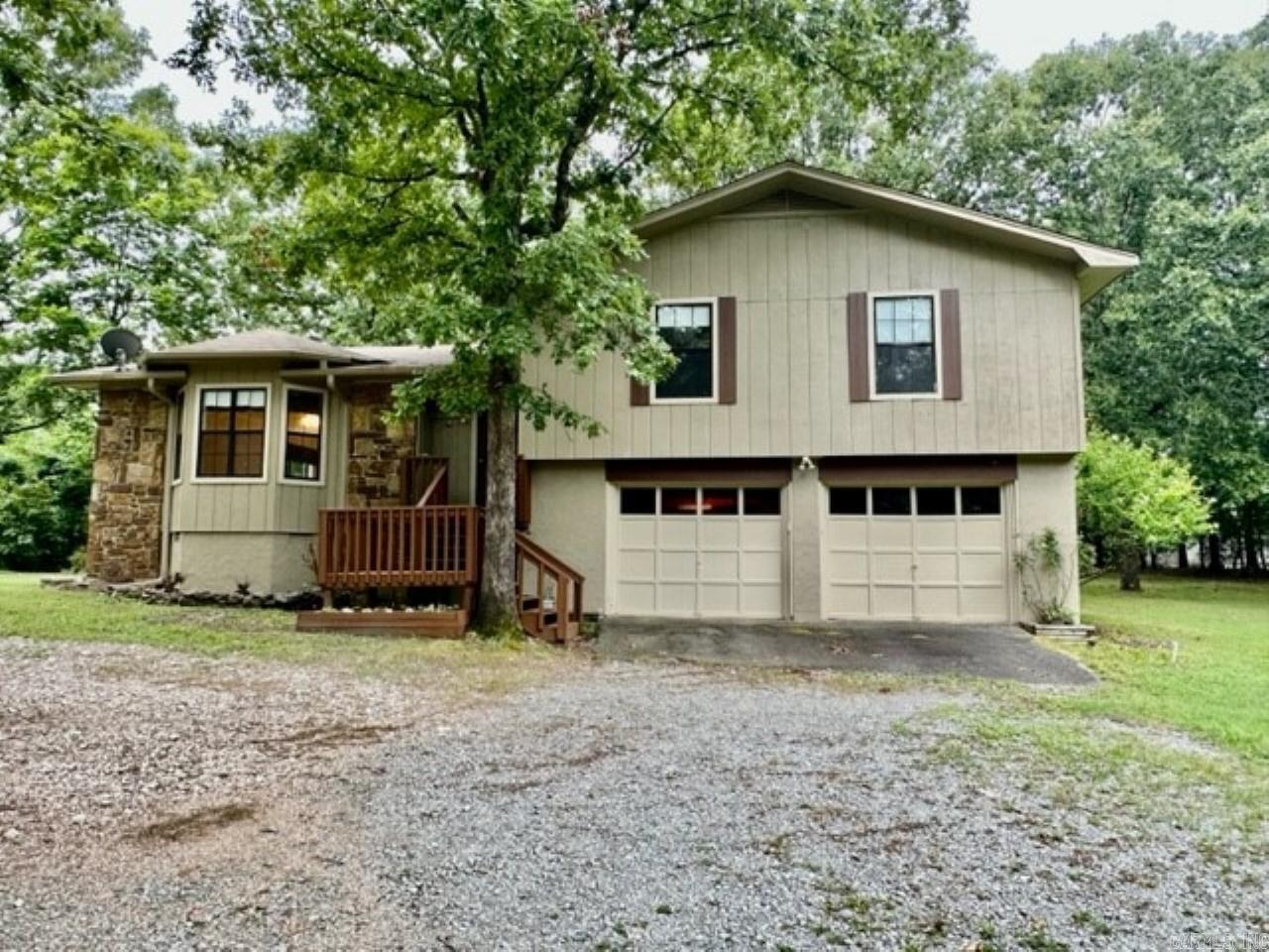 Don't miss this opportunity for this great 3 BR home located on 3 beautiful acres plenty of room for gardening and other projects. Sprinkler system runs on well, house on city water. Two decks off back of home, large garden area, acreage cleared of underbrush with large trees remaining. Bill of Assurance allows for additional home to be built on lot. Located near Bryant's Springhill Elementary. with easy access to shopping and I-30.