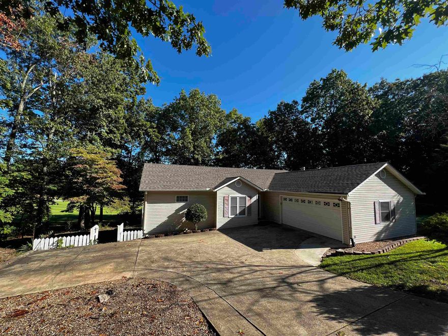 EASY AND AFFORDABLE GOLF LIVING IN THE OZARKS, Gorgeous Golf front setting nestled on Cherokee Village's south course. This private maintance free home has 3 BR'S that are spilt along with 2 full baths with the primary having a large jetted tub! along with a walk in shower, A two car garage,  A very nice open plan with eat in breakfast bar and dining area just off a good size living area ALL taking full  advantage of along with a beautiful deck area looking across a two fairway golf course view!! with an abundance of large dogwoods," SWEET" is the word that comes to mind! Complete with  cart storage area under your house, ride your cart to the course, just like the country club living only for a fraction of the cost. Owning property in Cherokee Village  comes with membership of 7 lakes, marinas, parks, trails,  2 golf courses, community center, pickle ball, weigtht room,tennis, pools, lake beach, river beach, access to the S. Fork of the Spring River and being minutes to several access points on the S. Fork and Spring RIver for amazing float trips and fishing!!! Golf living at an affordable price!! check it out today!!