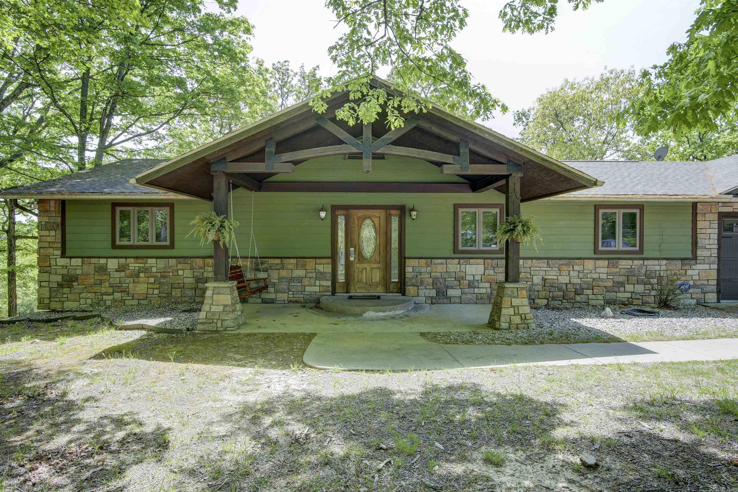 Investor Package on Beaver Lake! VRBO Home and +/-70acres. Ozark family hideaway home with breathtaking views of Beaver Lake.4BR, 3. Ba. 2 separate living areas & 2 gourmet kitchens. Panoramic views from the 8 subdivided < 1 acre lots. Another 34ac tract & 27ac tract with several breathtaking building sites. 800' of boat dock zoning. Accessible from Jackson Ridge, Honey Creek Rd., and Mundell Rd. 1.5 miles to boat launch and Starkey Marina. 9 miles to Eureka Springs and 30 miles to Rogers. No boat dock.