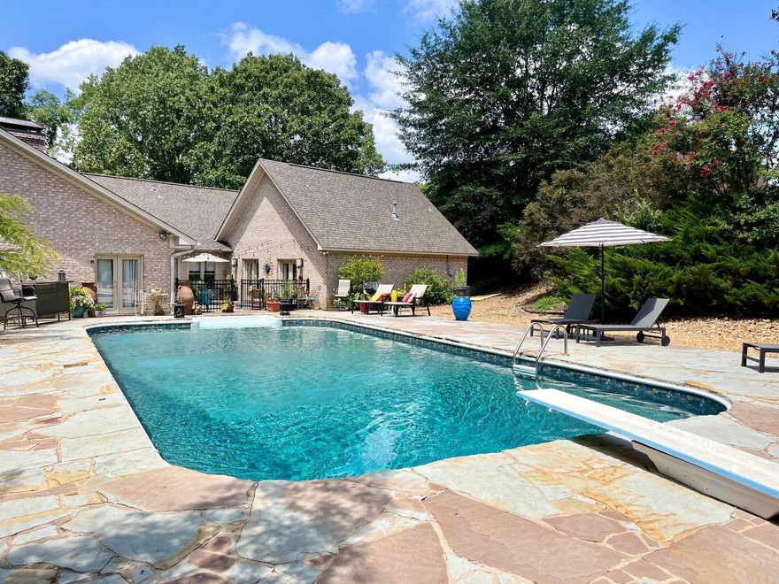 BACK ON MARKET due to no fault of the seller for the second time!! Their loss is your gain. This luxurious rancher is located within the city limits of Benton but offers the seclusion of country living. You will find 3 generously sized bedrooms complete with plentiful walk-in closets and 2 full baths. Beyond the sun kissed Florida room is an additional 4th bedroom that is massive in size and could easily lend itself as a game room, in-laws quarters, or man-cave. That large bonus room is also host to its own full bath and wet bar perfect for entertaining. The sprawling chef's kitchen offers stainless steel appliances, impressive granite countertops, and a 6 burner Electrolux Icon gas stovetop as just a few of it's fine amenities. Nestled in a quiet cul-de-sac of Wellington Pointe, you can enjoy the peace and tranquillity of your breathtaking pool while listening to the bubbling waterfall nearby. This stunning backyard oasis is fully fenced for optimal privacy.  Enjoy added peace of mind with the Safe Room located in the garage. New for 2023: HVAC, pool liner, exterior lighting, and insulated garage doors.  MUST SEE! $1000 Buyer's Agent Bonus with closing offer.