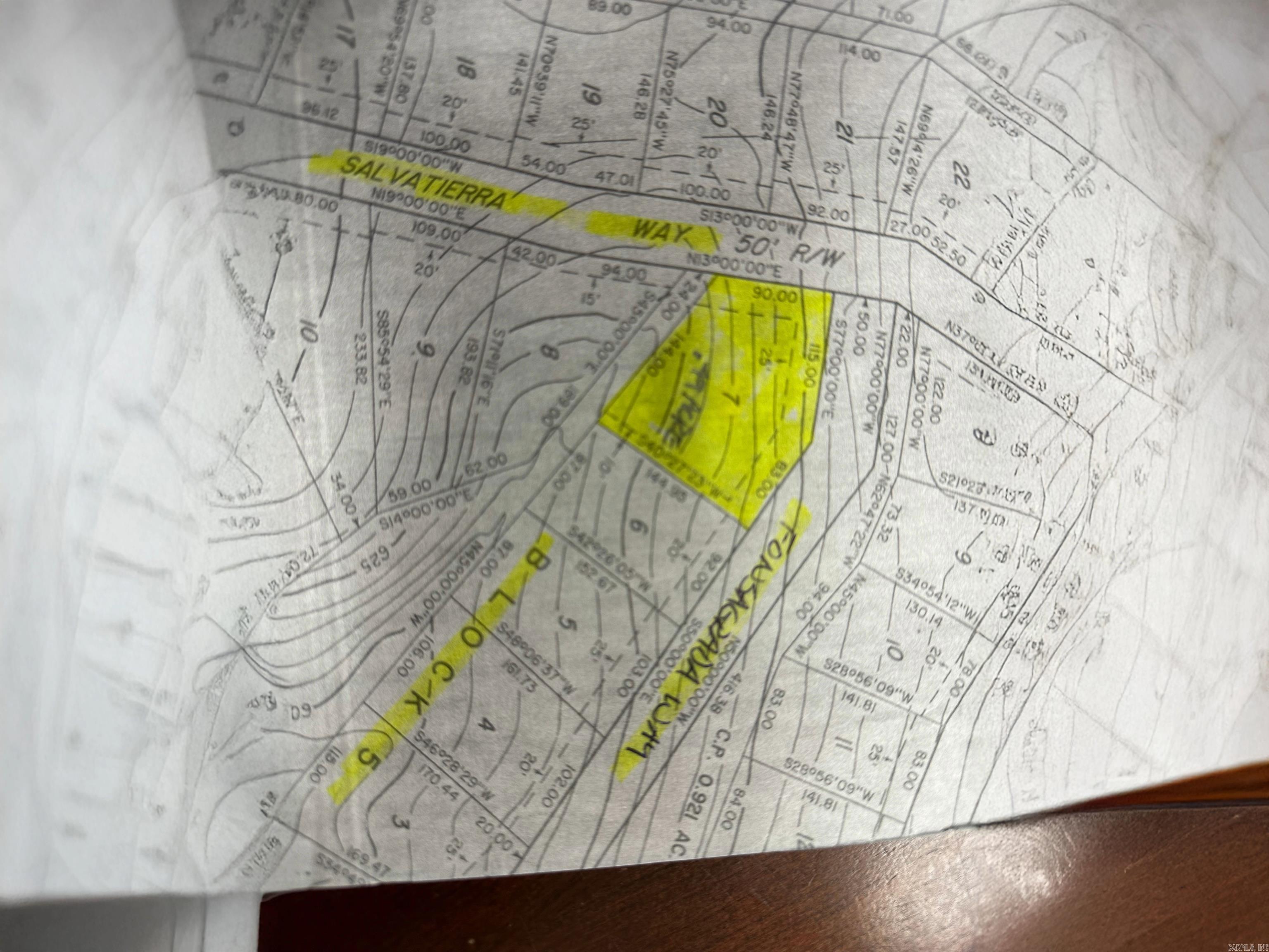 1/2 acre corner lot perfect for building a walkout style home. On the corner of Fonsgrada Way and Salvatierra Way. Vacant lot next door and a strip of common property to the rear. There are not many 1/2 acre lots left. If you are looking for privacy, don't let this one get away.