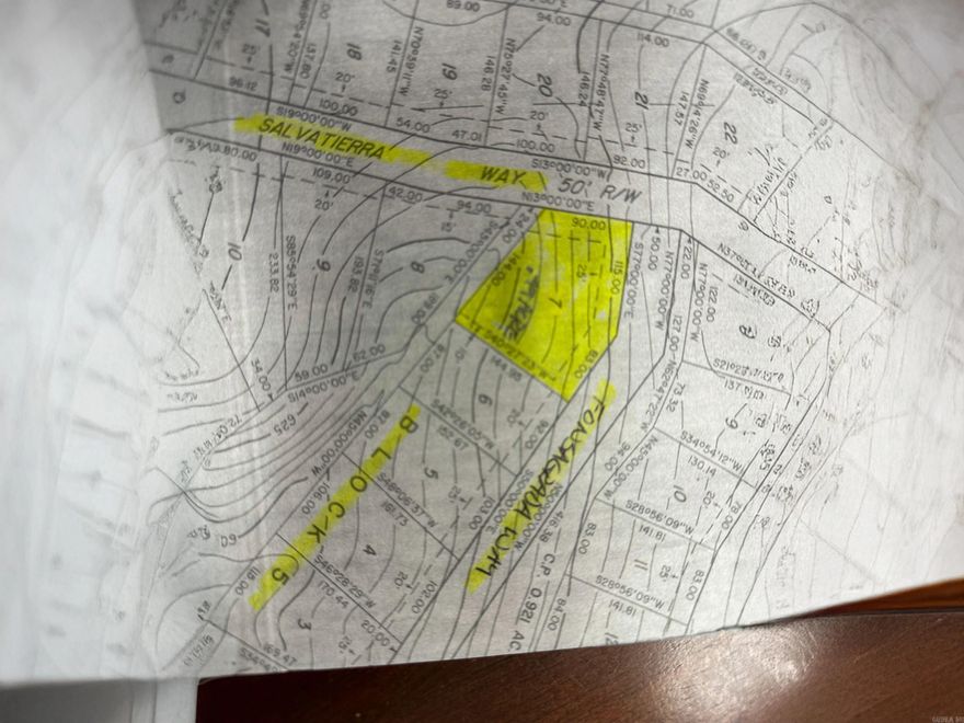 1/2 acre corner lot perfect for building a walkout style home. On the corner of Fonsgrada Way and Salvatierra Way. Vacant lot next door and a strip of common property to the rear. There are not many 1/2 acre lots left. If you are looking for privacy, don't let this one get away.