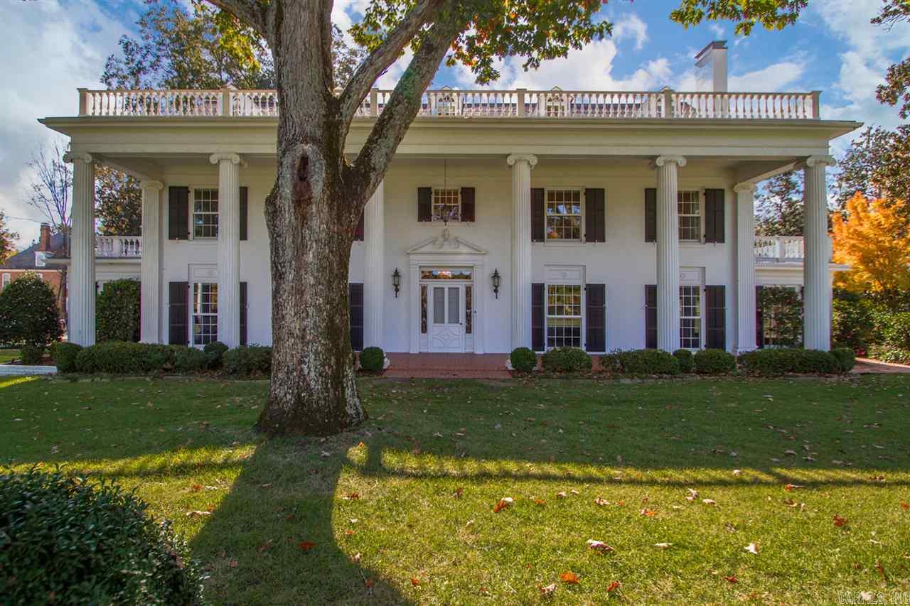 Magnificent Country Club Heights home located on 4 lots overlooking the picturesque10th fairway of the CCLR golf course. The ultimate setting for family living and phenomenal entertaining. Classic 1920’s Southern Colonial with elegance and charm throughout. Beautiful formal areas, wonderful proportions. Chef ’s Kitchen and light filled Breakfast Room. Banquet-sized formal Dining Room, spacious Living Room with spectacular views. Inviting Den w/ fireplace. Expansive living quarters on 2nd and 3rd, Gated